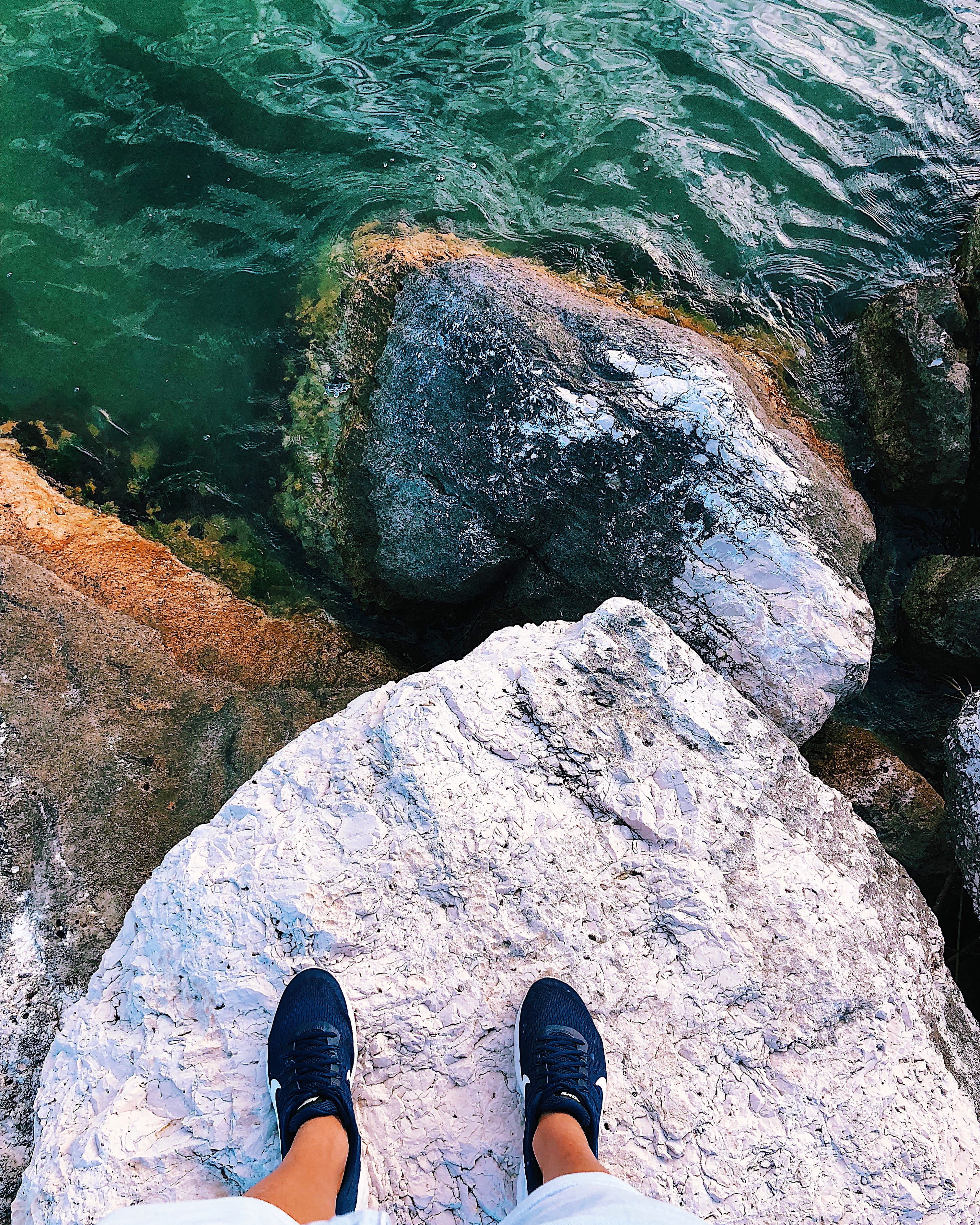 rock, water, lifestyles, pesaro, one person, human leg, human foot, personal perspective, nature, green, outdoors, body part, shoe, sneakers, real people, Phone HD Wallpaper