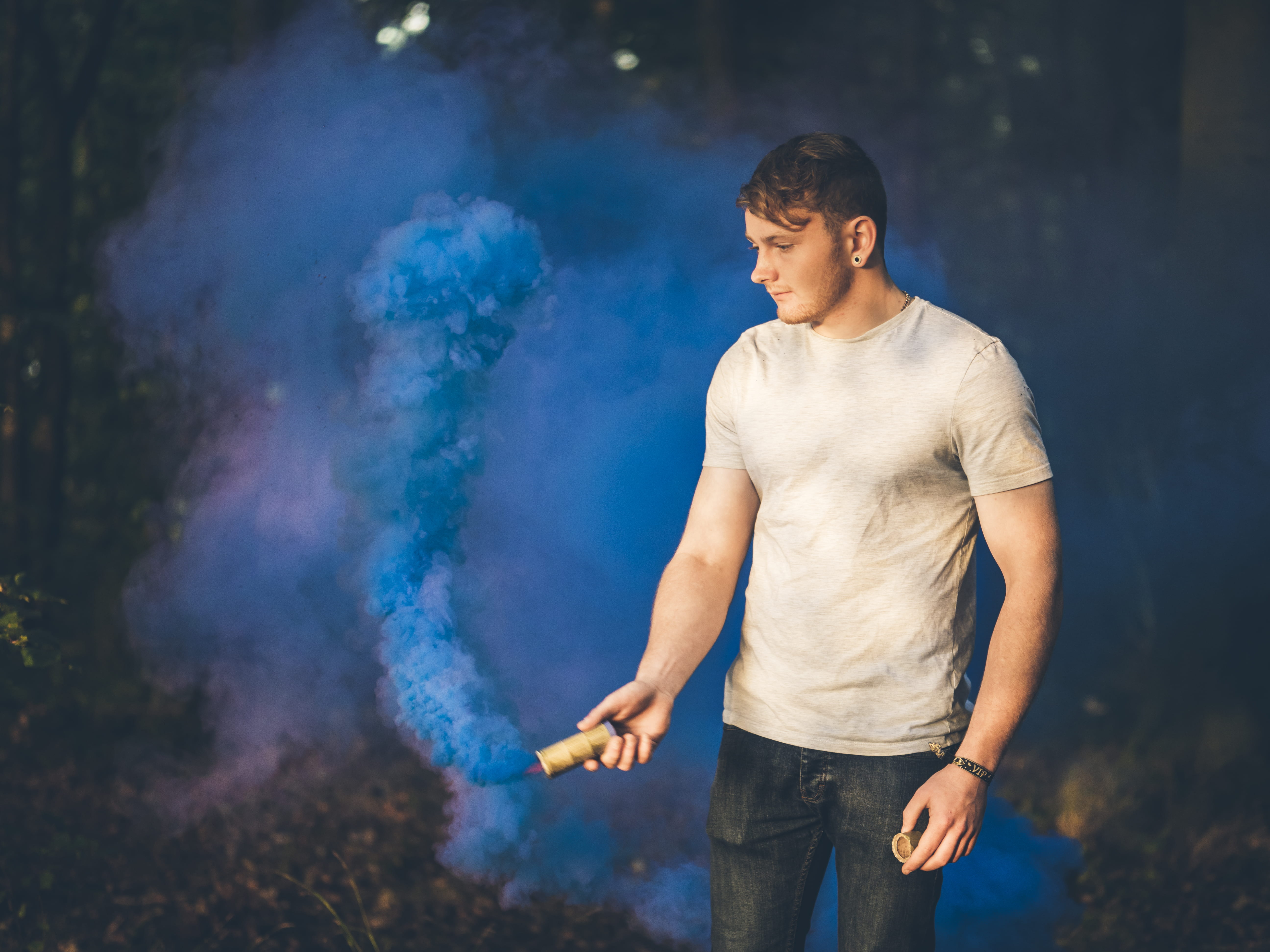 portrait, smoke - physical structure, wood, day, focus on foreground, lifestyles, forest, young adult, outdoors, jeans, real people, grenade, three quarter length, HD Wallpaper