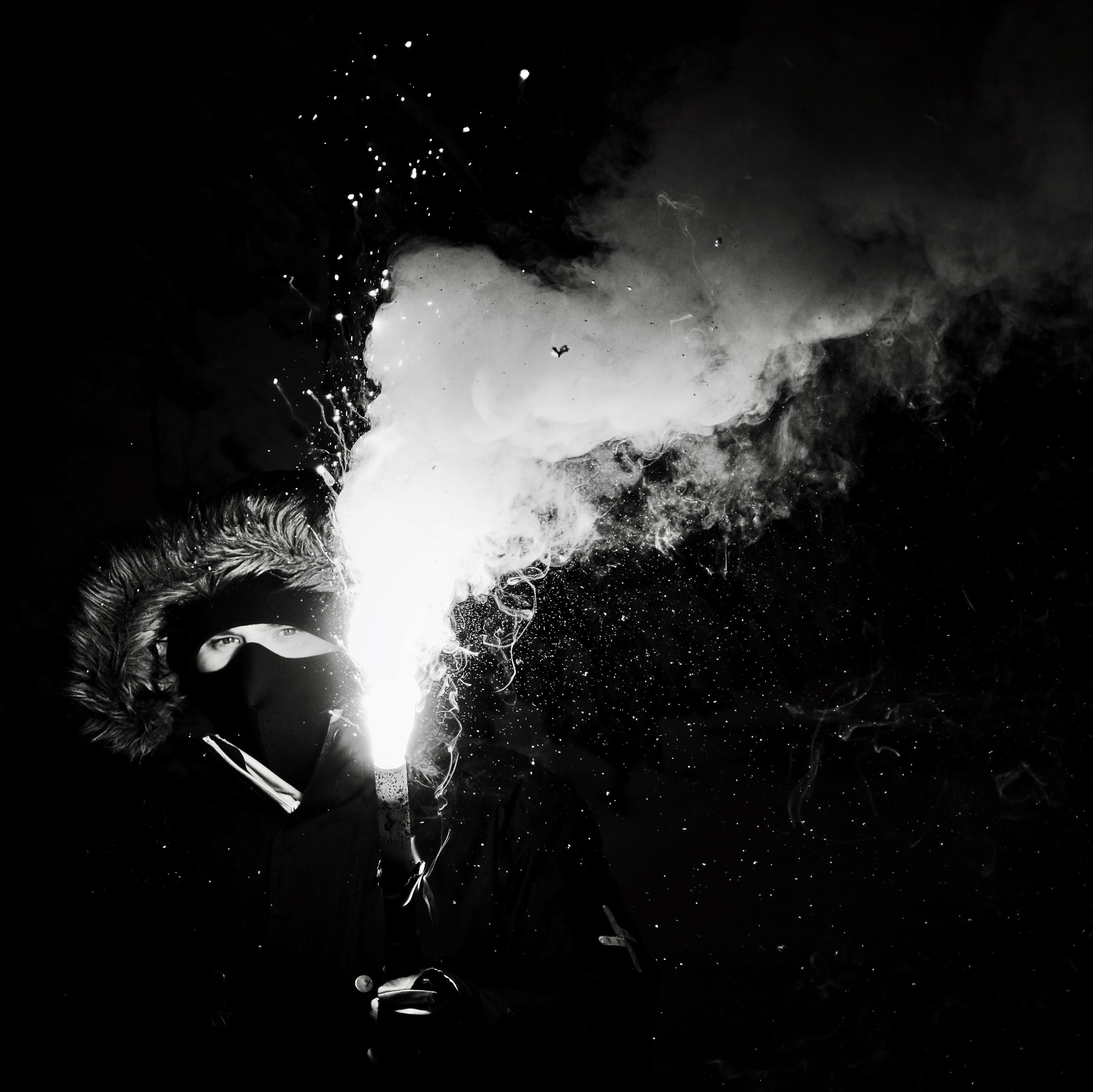 burning, arts culture and entertainment, fog, black-and-white, exploding, dark, mask, sparks, energy, grayscale, holding, nature, long exposure, person, HD Wallpaper