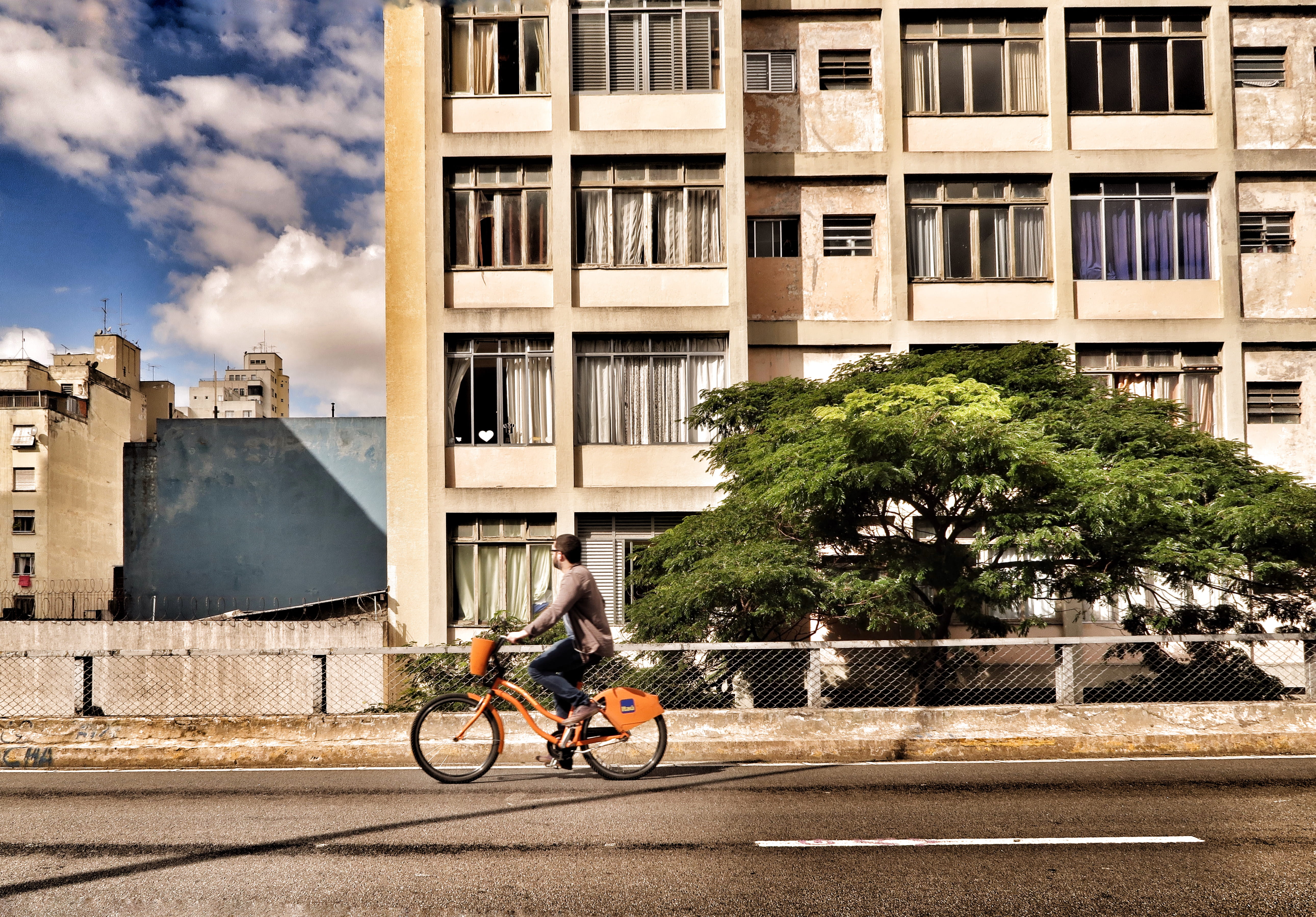 ride, person, outdoors, tree, land vehicle, man, 5K, lifestyles, ｂｉｋｉｎｇ, one person, street, architecture, near, plant, building Exterior, orange, daytime, HD Wallpaper