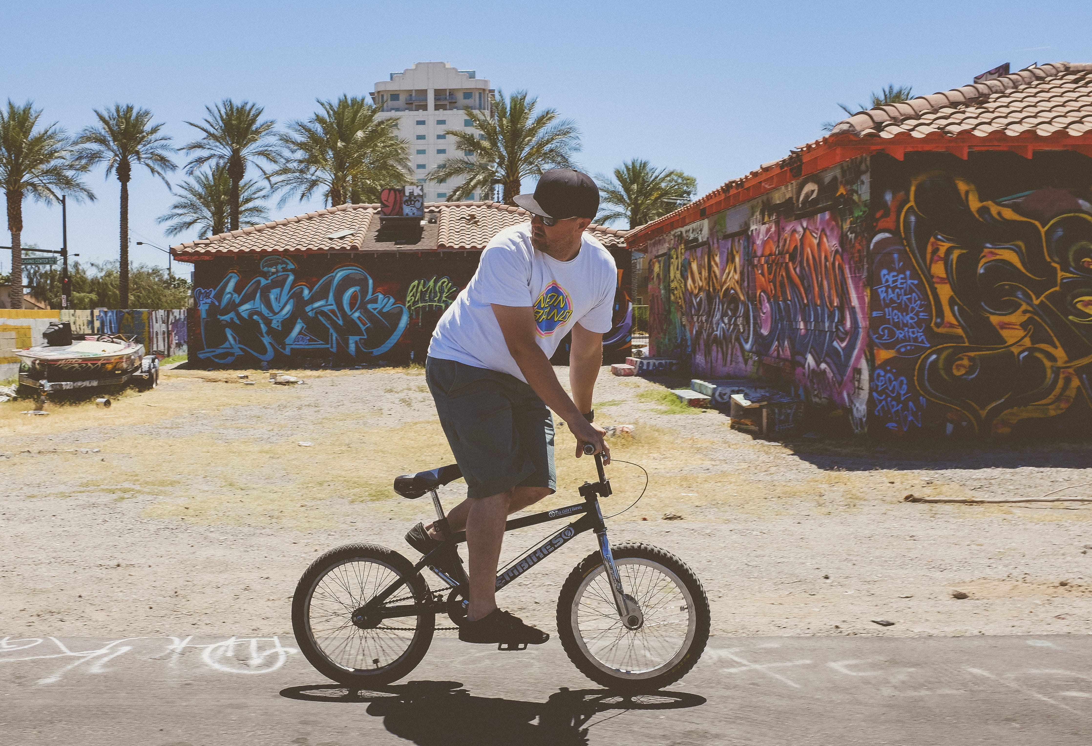 shirt, one man only, riding, architecture, men, day, land vehicle, black, leisure activity, cycling, bicycle, real people, on road, daytime, using, bike, HD Wallpaper