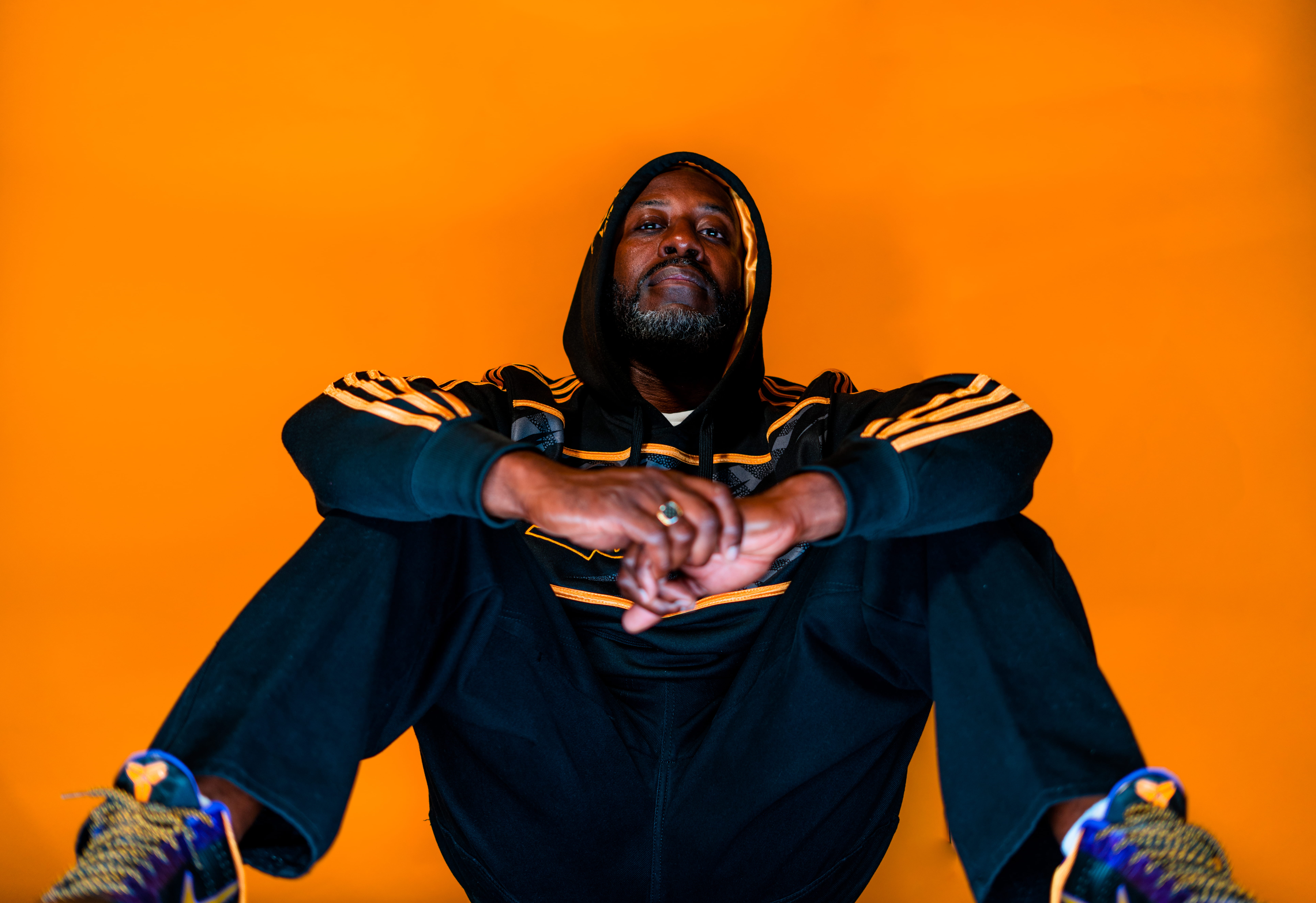 gesturing, arms outstretched, studio shot, ground, jacket, pants, young adult, colored background, kobe, color, sport, photographer, facial hair, men, HD Wallpaper