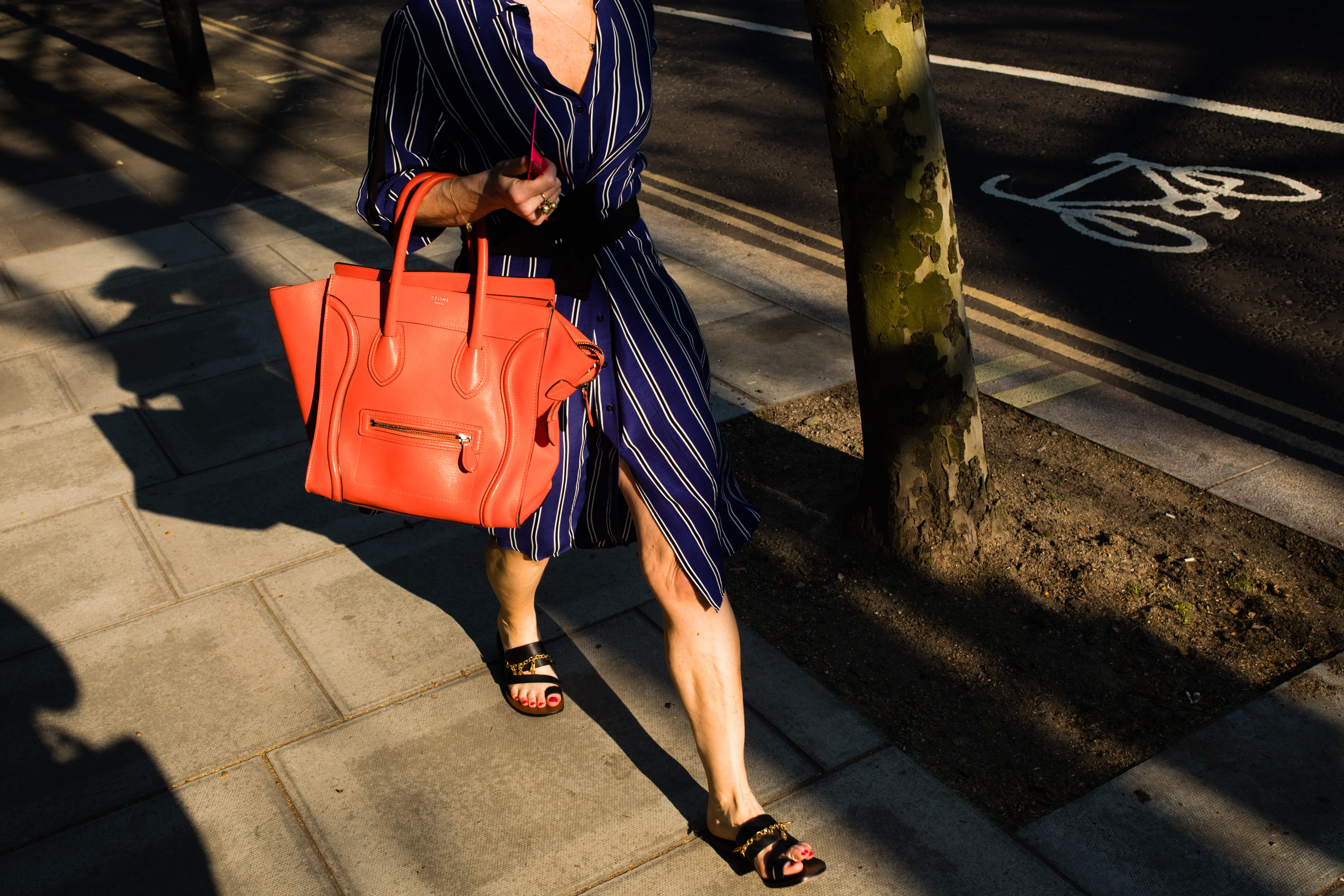 low section, street photography, style, one person, woman, tree, sunlight, sunny, wearing, fashion, dress, urban, casual clothing, orange, footpath, walk, HD Wallpaper