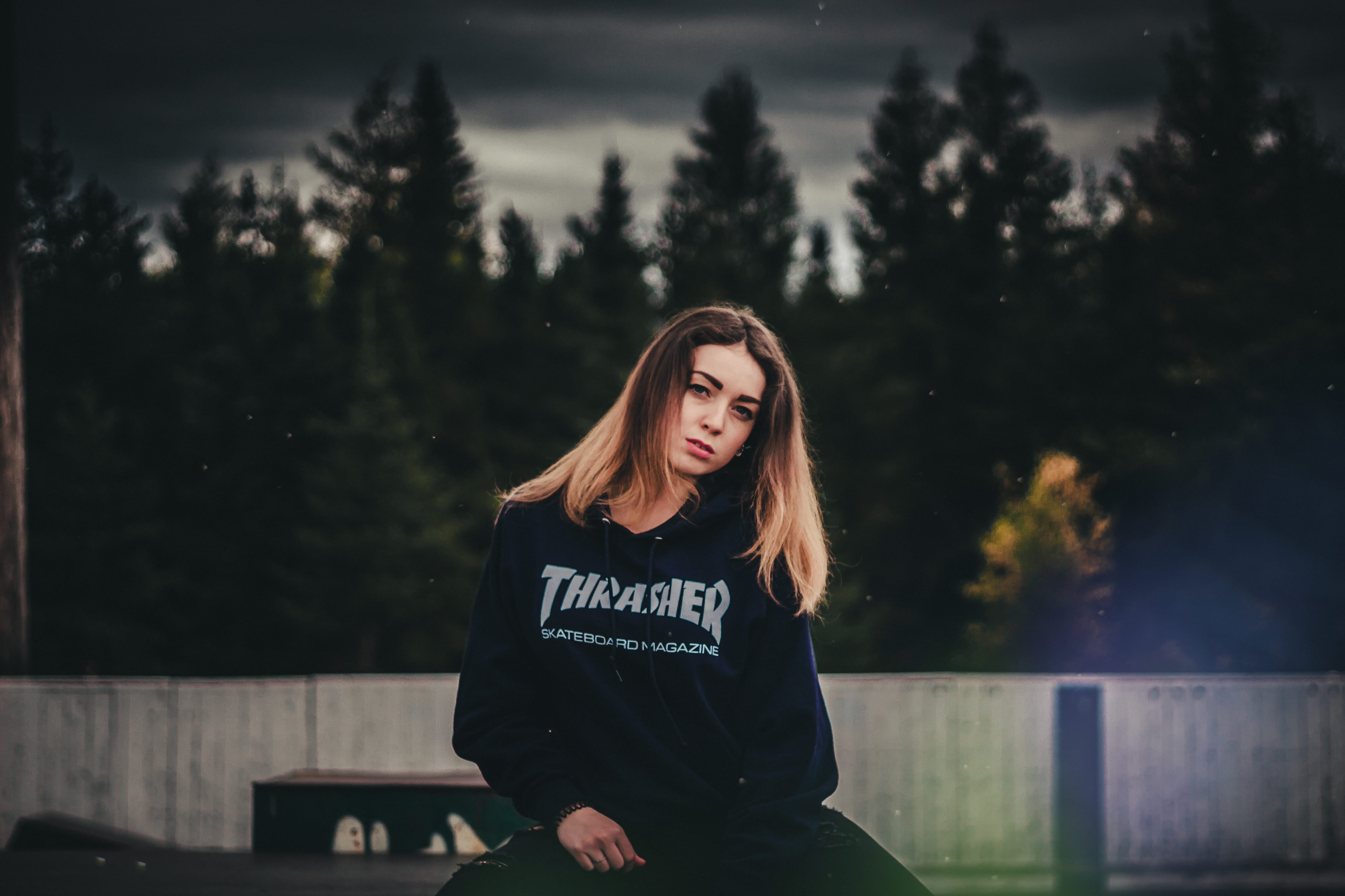 beautiful woman, concrete, front, standing, lifestyles, real people, sweater, photo, 4K, fence, wearing, female, black, beauty, one person, nature, tree, HD Wallpaper