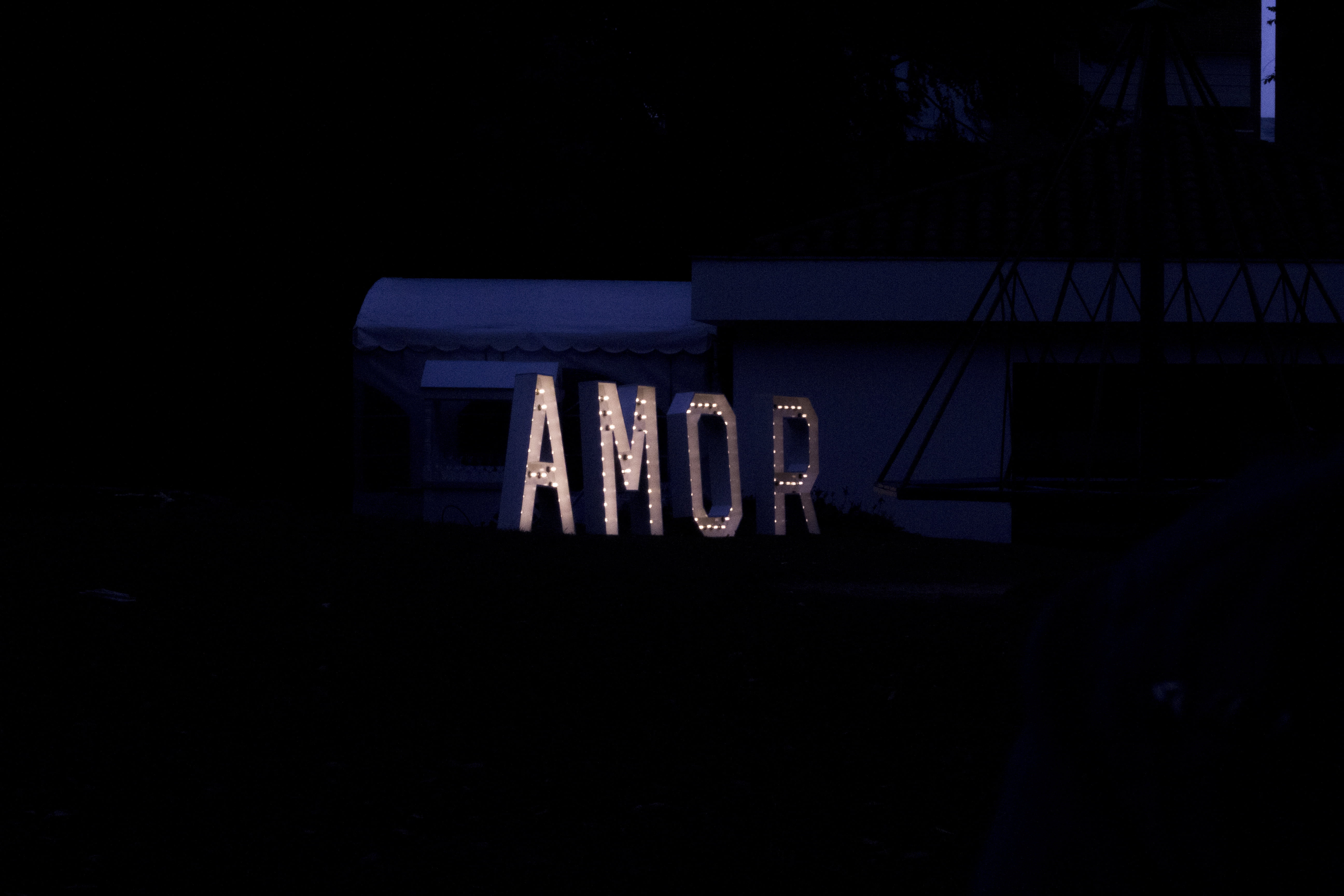text, building Exterior, single word, copy space, sign, urban Scene, 5K, signage, wood - material, amor, night, western script, light - natural phenomenon, HD Wallpaper
