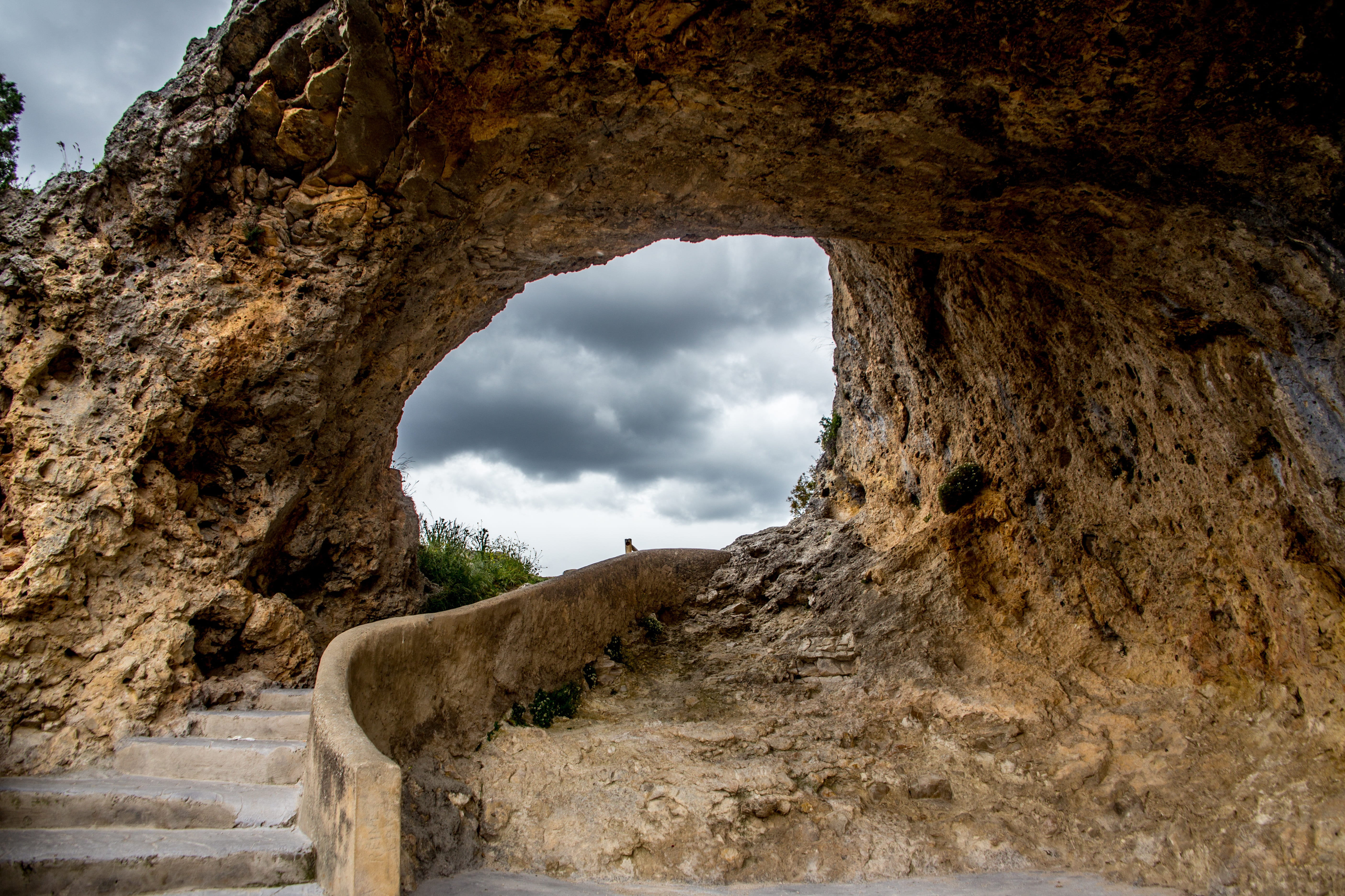 barranco del diablo, solid, storm, clouds, no people, brown, ancient, sunset, mountain, nature, eye, arch, landscape, the past, outdoors, natural arch, HD Wallpaper