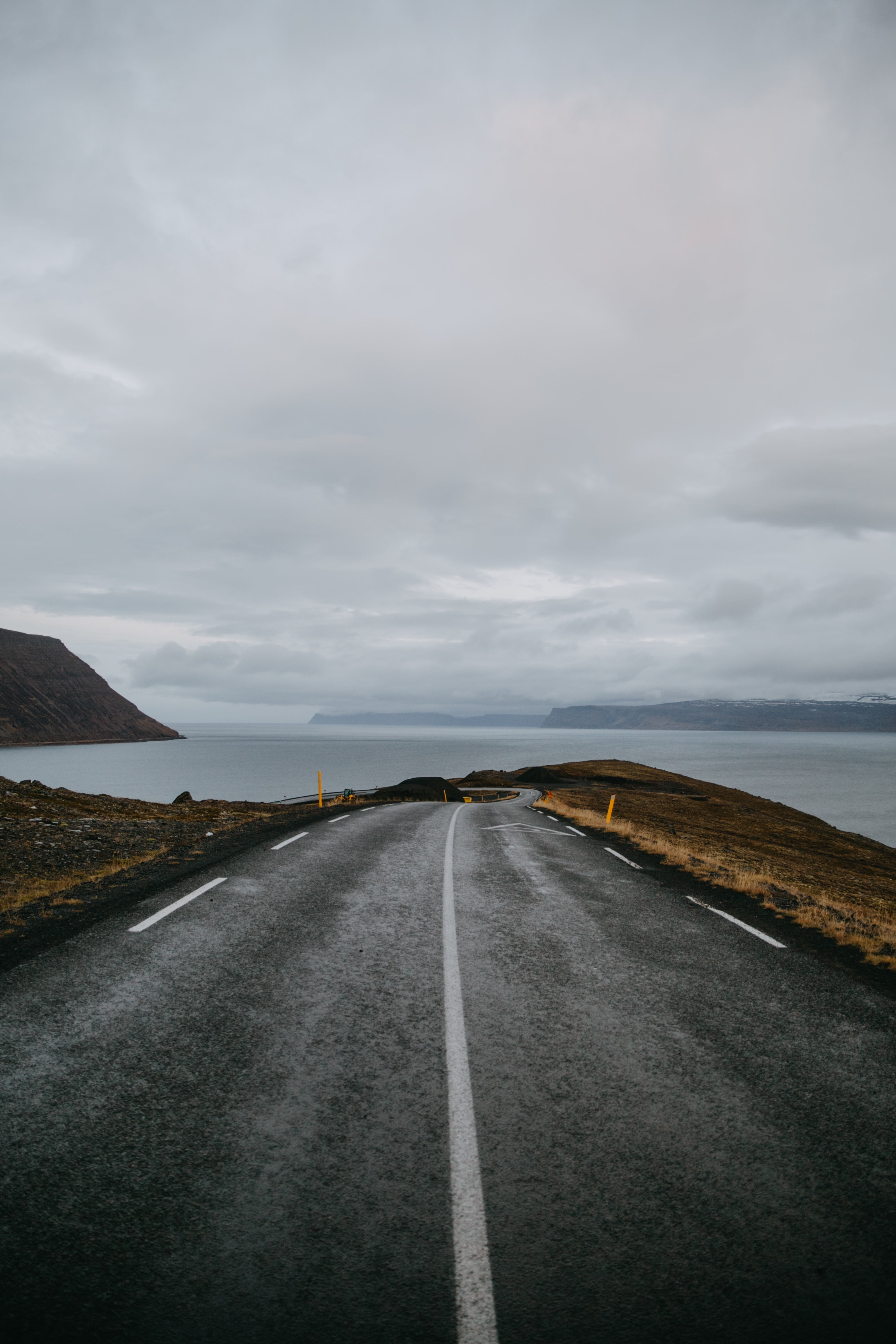 tourism, rock - Object, cliff, uK, marking, outdoors, island, road, shore, sky, dividing line, hill, diminishing perspective, transportation, road marking, Phone HD Wallpaper