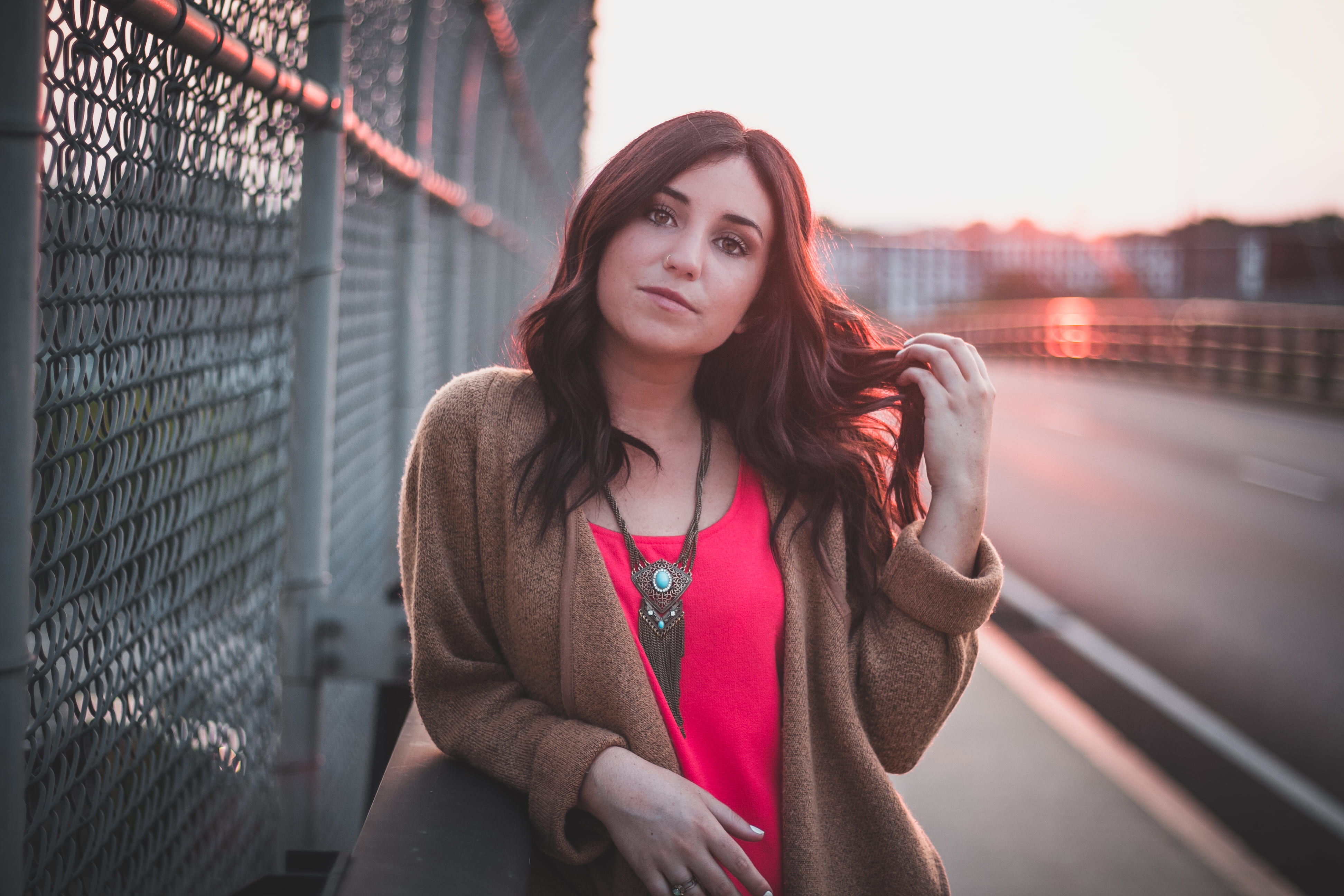 fence, long hair, woman, front view, standing, looking at camera, one person, barrier, holding, adult, clothing, hairstyle, beautiful woman, urban, leaning, HD Wallpaper