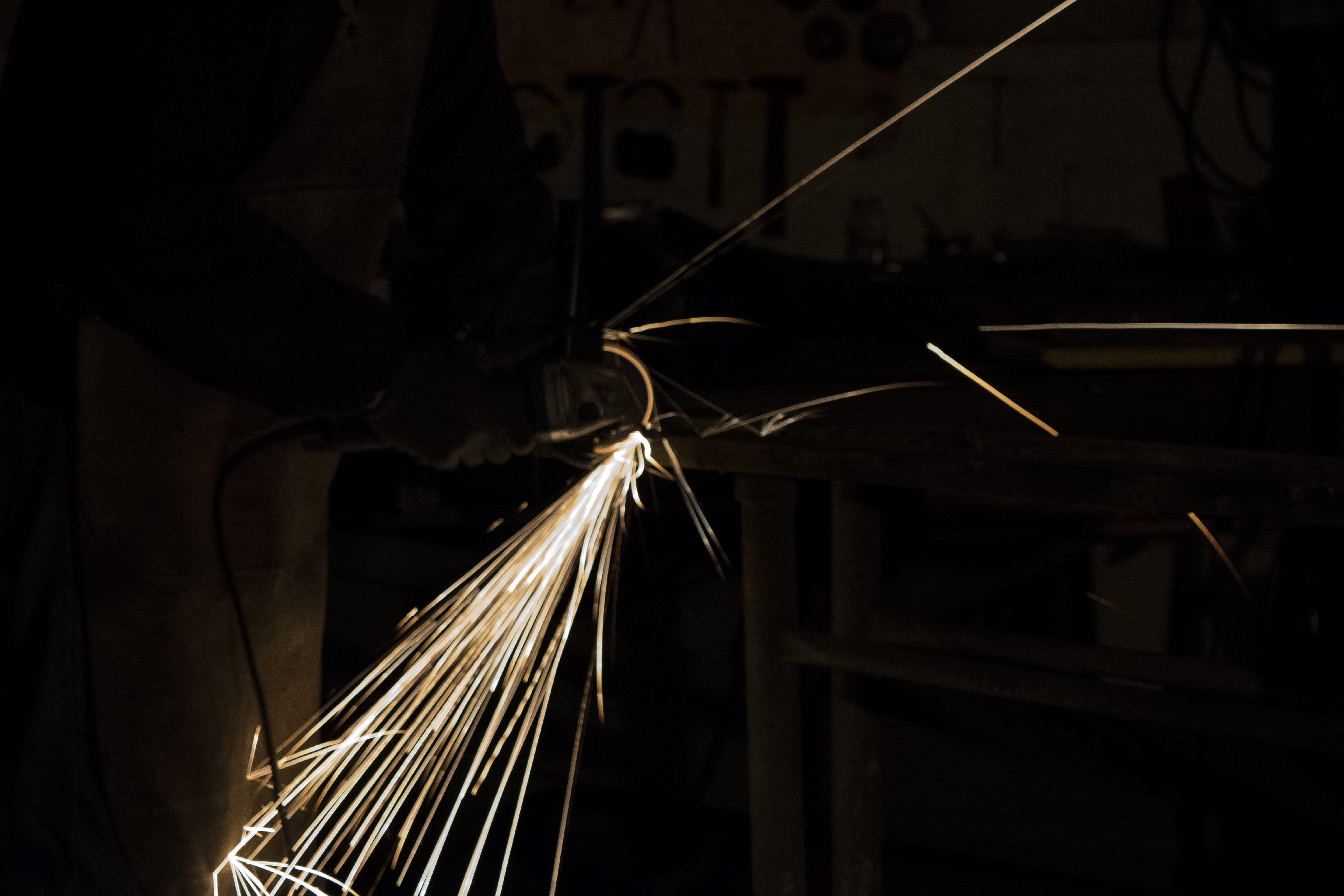 sparks, illuminated, human, fire, indoors, one person, lighting, welding, blacksmith, wood, close-up, iron, sparkle, light, clothing, light trail, motion, HD Wallpaper