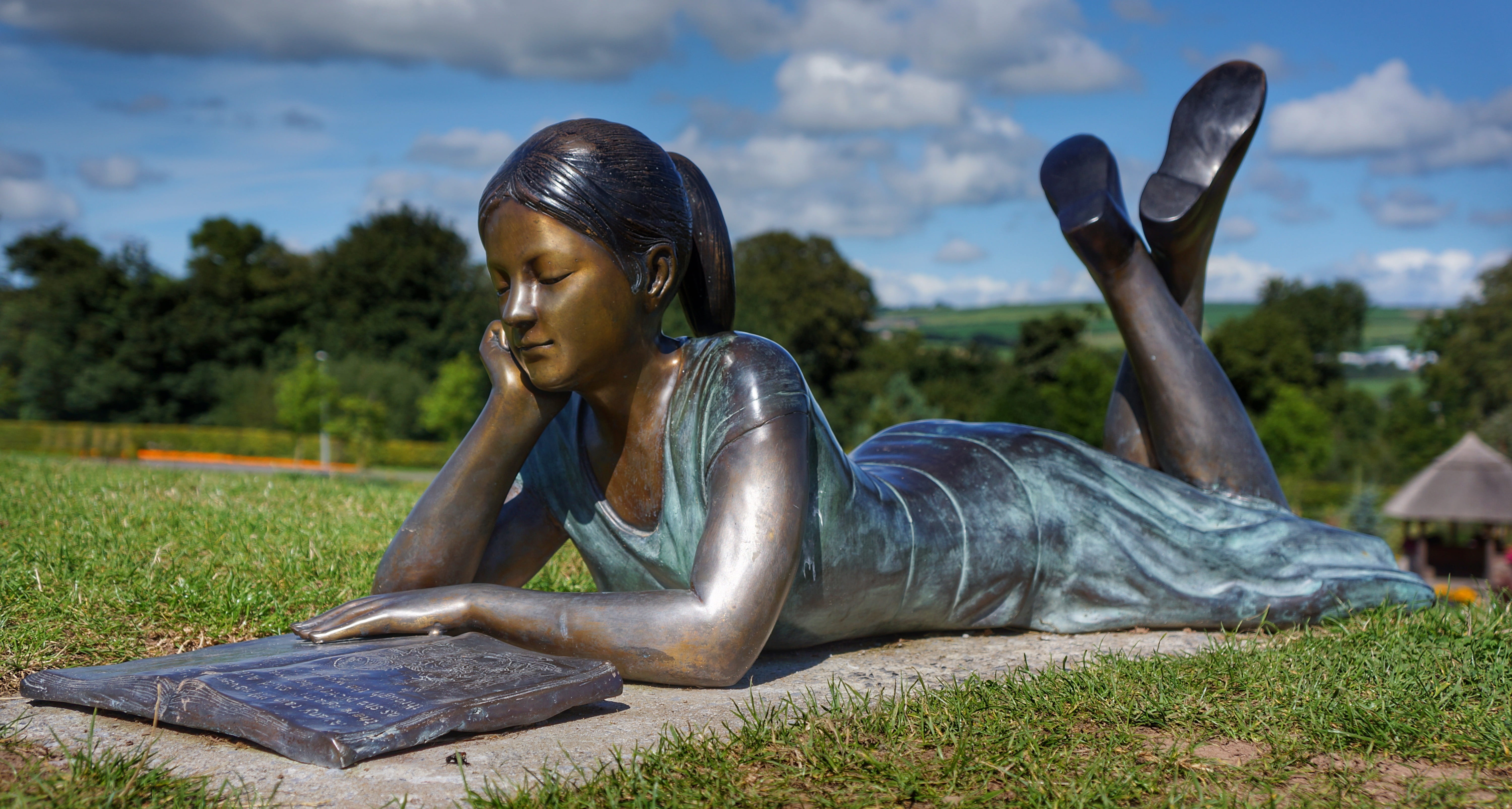 plant, outdoor, young women, cork, one person, healthy lifestyle, day, young adult, statue, book, adult, lying on front, sky, bronze, relaxation, leisure activity, HD Wallpaper