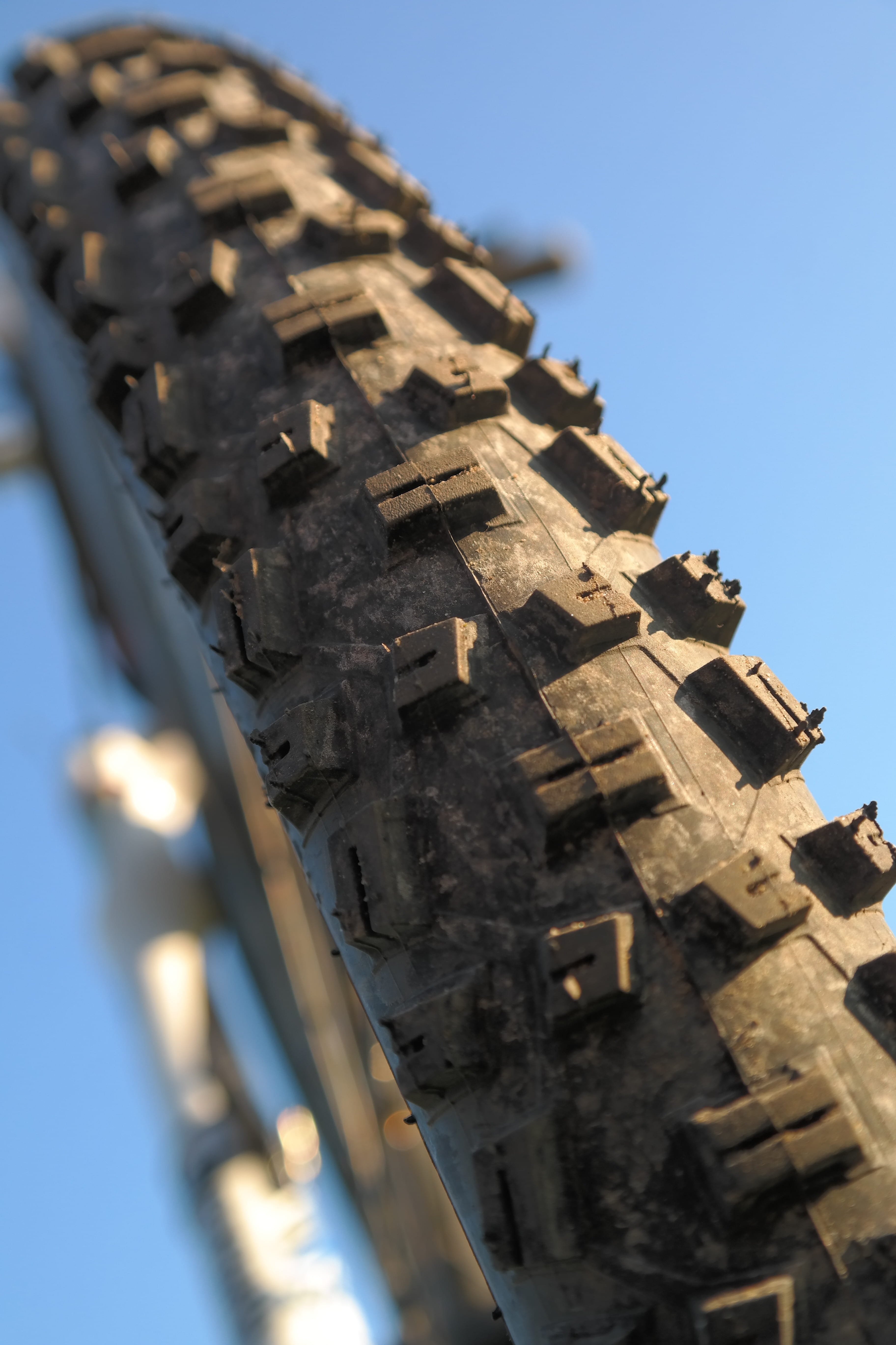 the past, 5K, building exterior, photography, sunlight, tire, building, blue, spirituality, nature, architecture, schwalbe nobby nic, low angle view, built structure, Phone HD Wallpaper