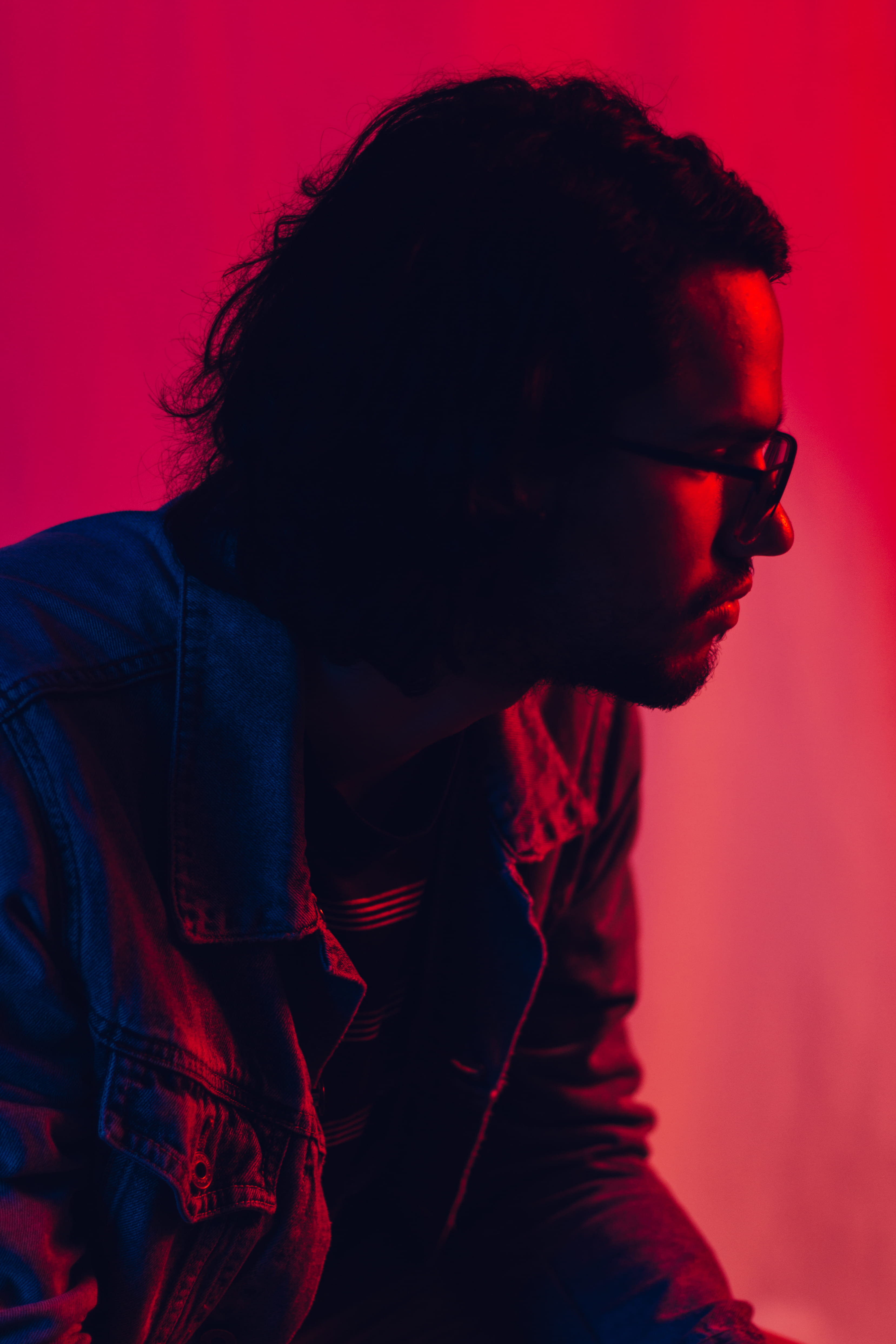 adult, indoors, harrington, colored background, women, contemplation, side view, young men, leather, looking, kit, red, real people, lifestyles, hairstyle, Phone HD Wallpaper