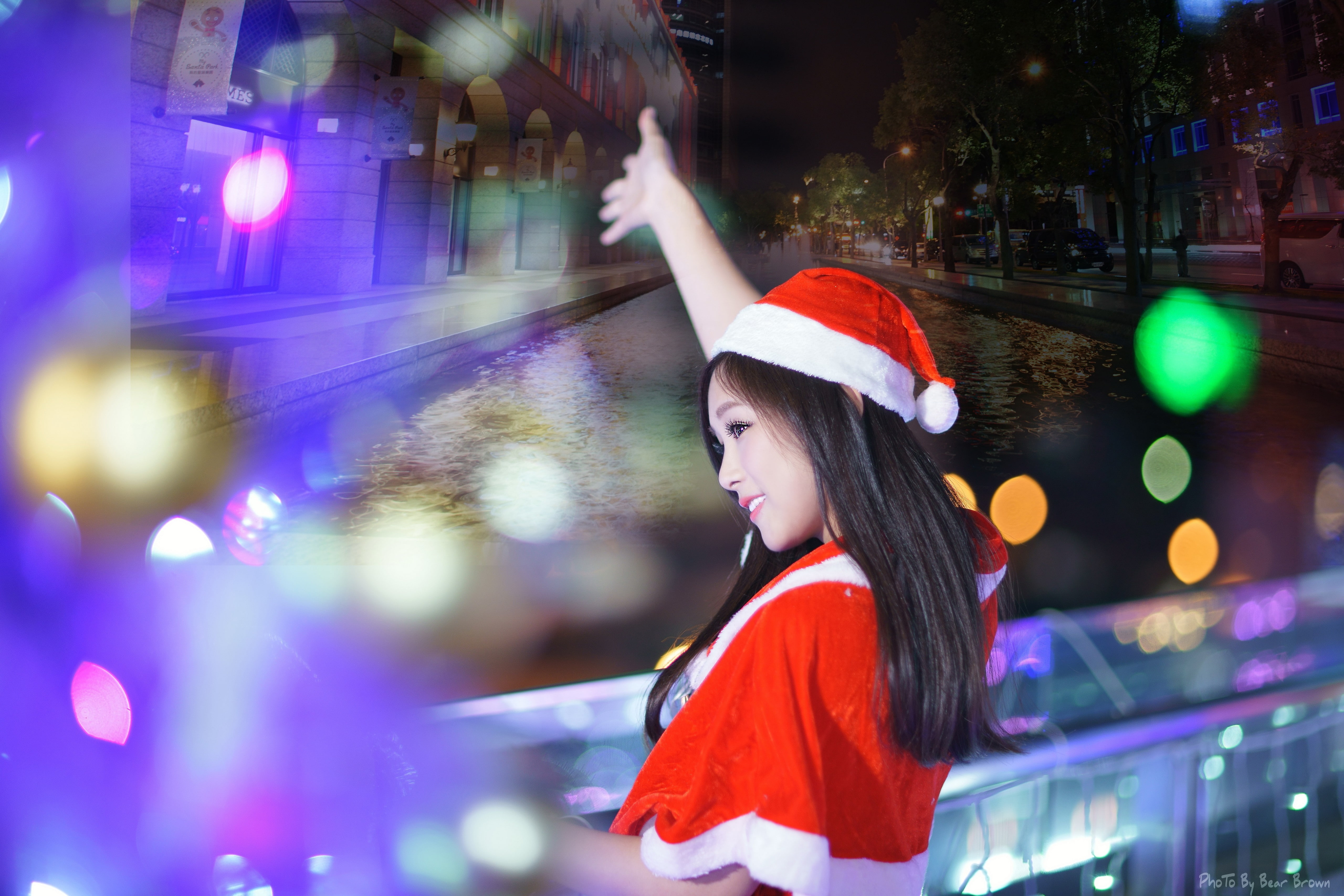 city, young adult, Asian, smiling, beautiful woman, Santa hats, black hair, hair, standing, night, portrait, adult, human arm, looking, Christmas, brunette, HD Wallpaper