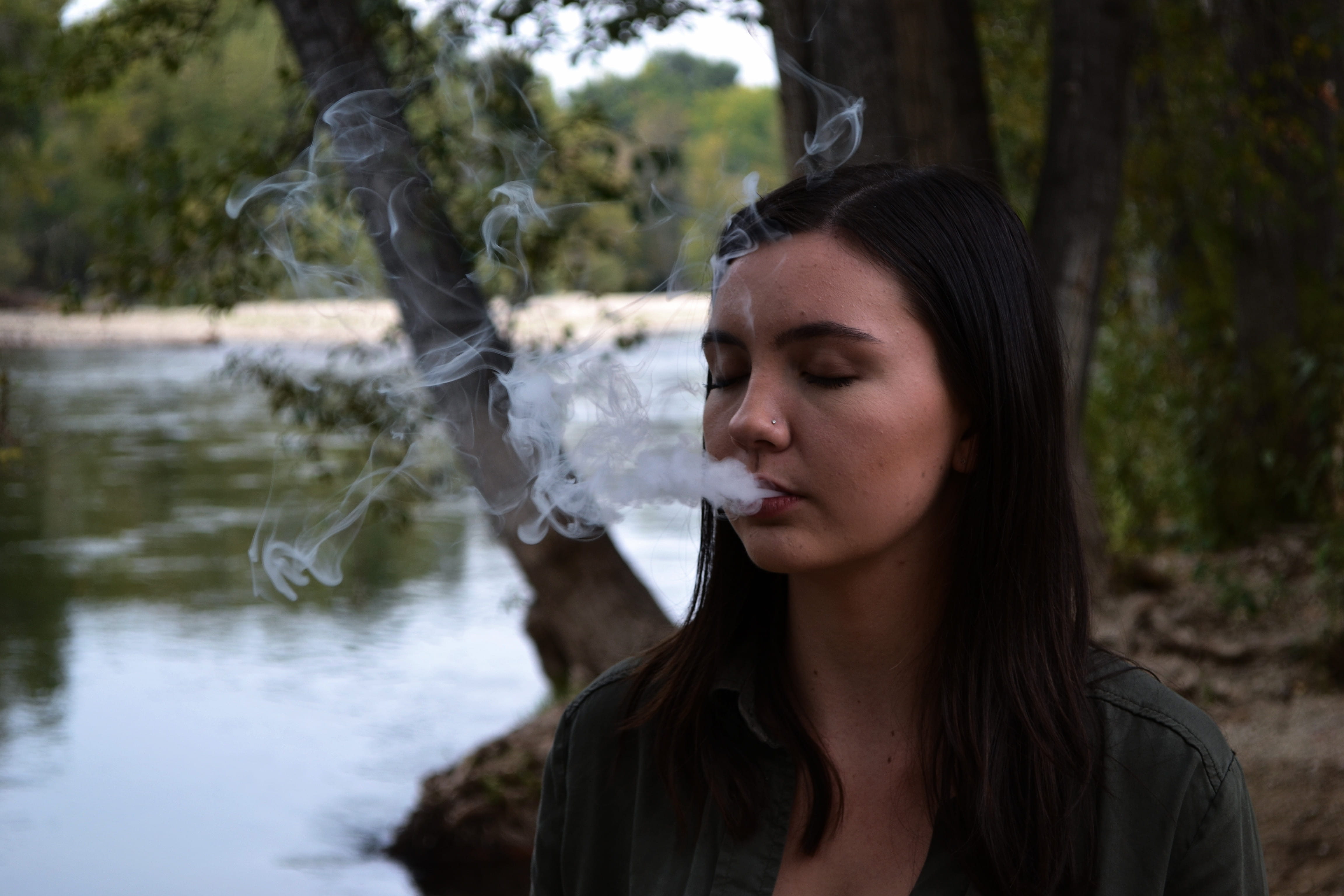 beautiful woman, young women, young adult, bad habit, looking, adult, coming, focus on foreground, headshot, day, one person, mouth, tree, real people, HD Wallpaper