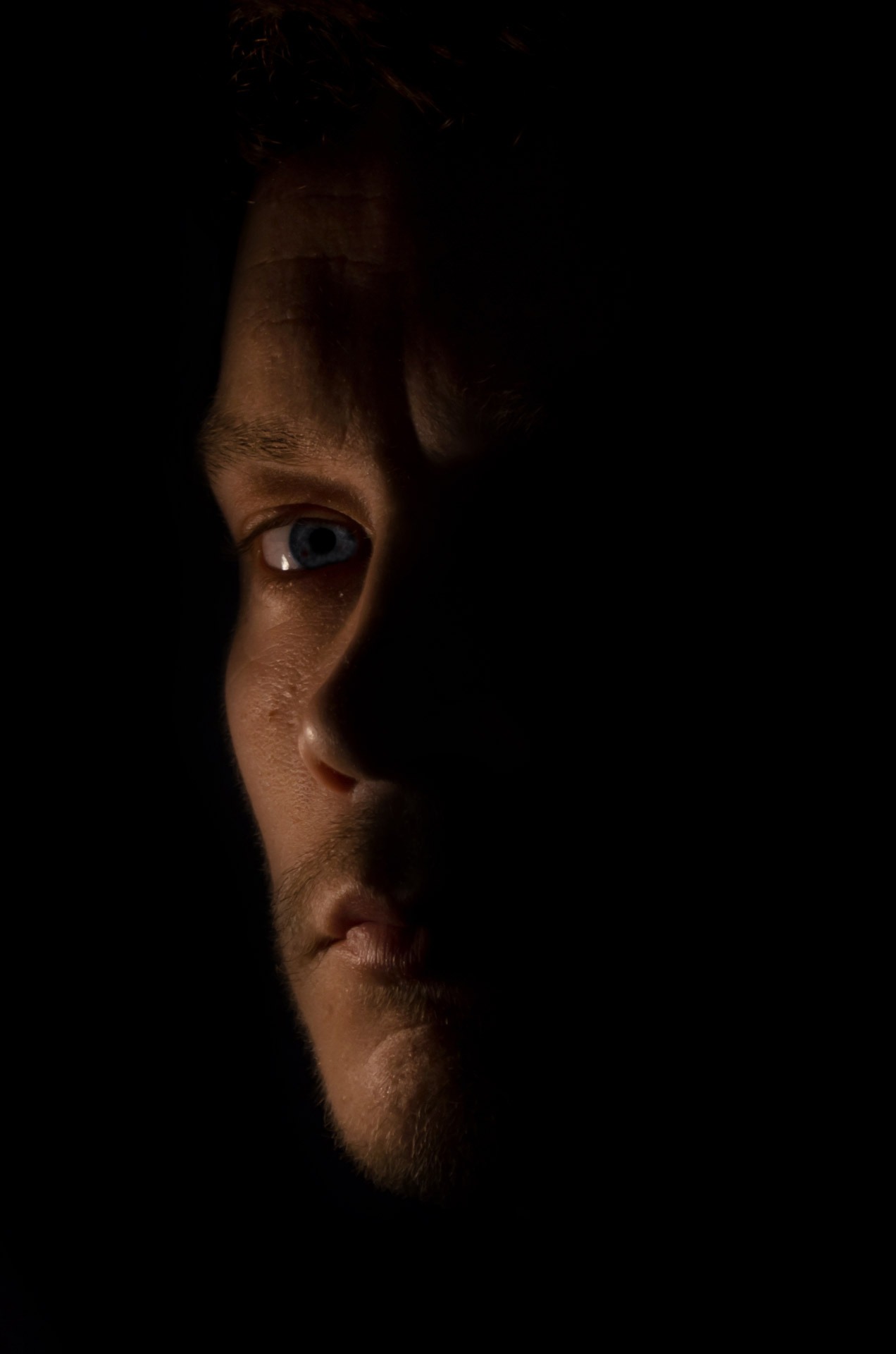 help, front view, black Background, shadow, copy space, human Face, looking at camera, low Key, eye, 1080P, emotion, serious, men, human body part, mood, Phone HD Wallpaper