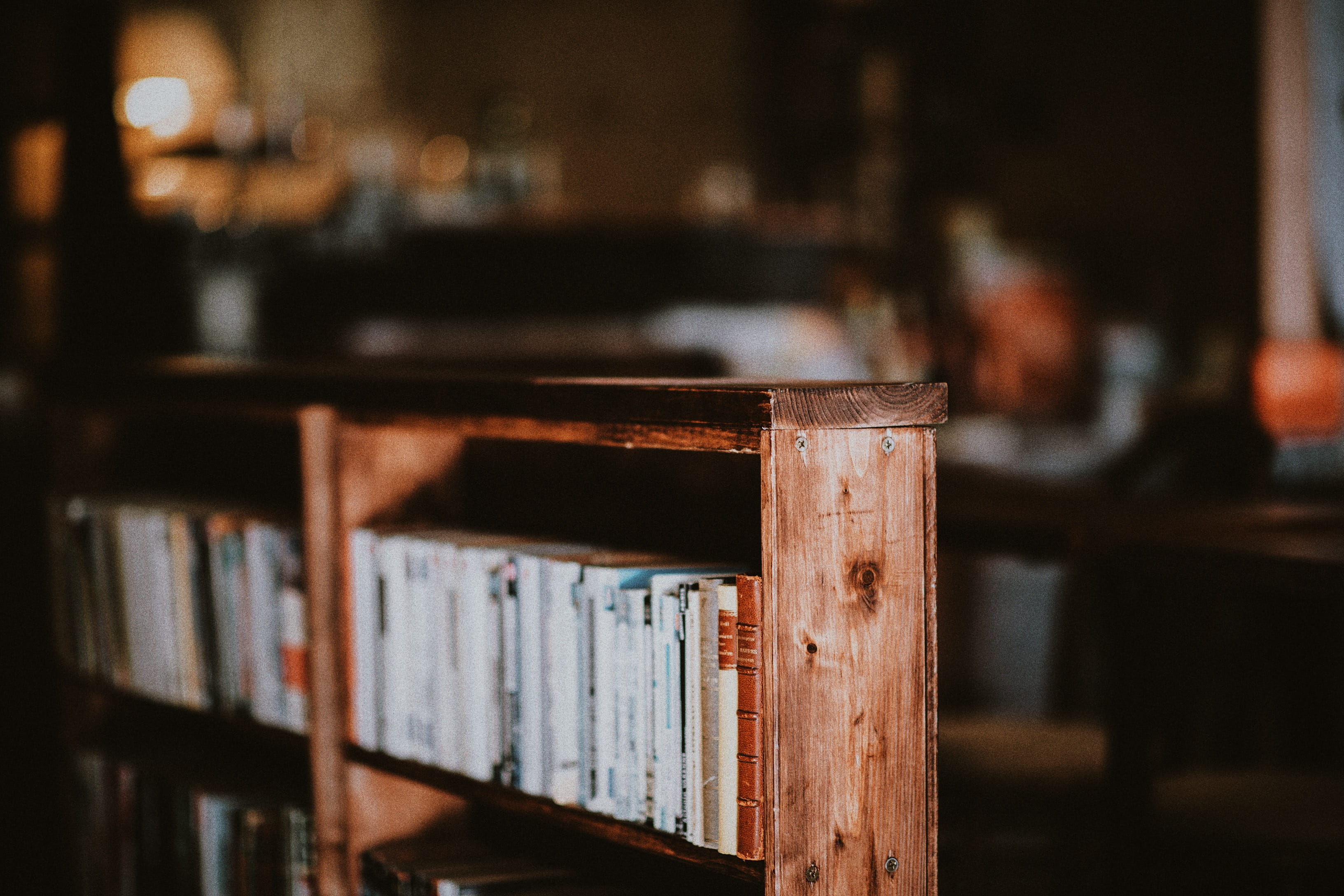 2K, books, bookshelf, furniture, domestic room, wooden, table, seat, education, library, wood - Material, old, stacked, brown, shelves, focus on foreground, HD Wallpaper