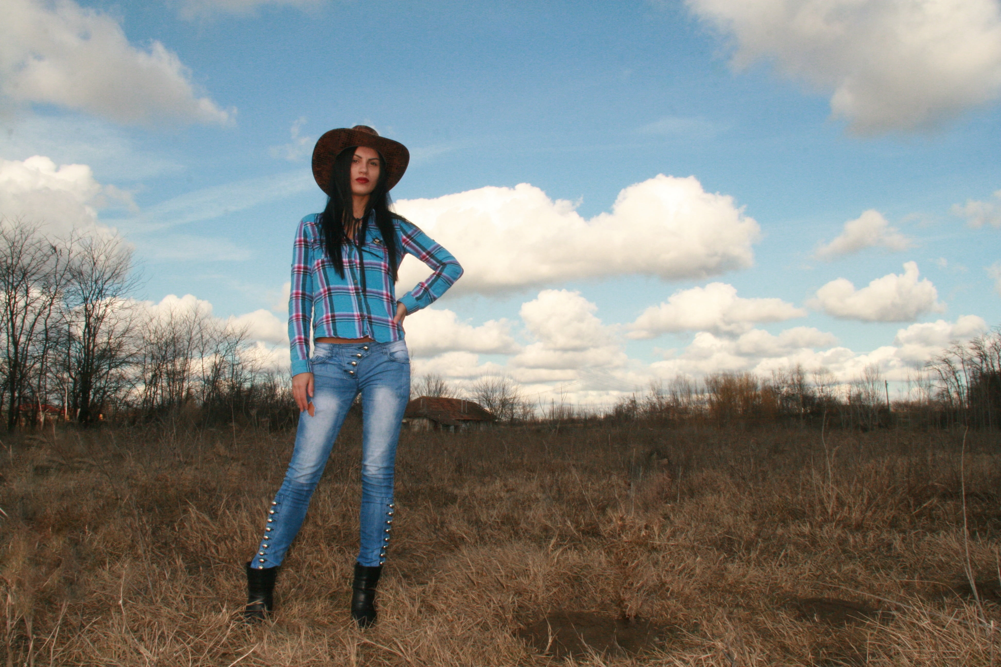 wild west, land, blue, shirt, looking at camera, clothing, young adult, standing, sky, hat, front view, plaid, field, cowgirl, one person, full length, HD Wallpaper