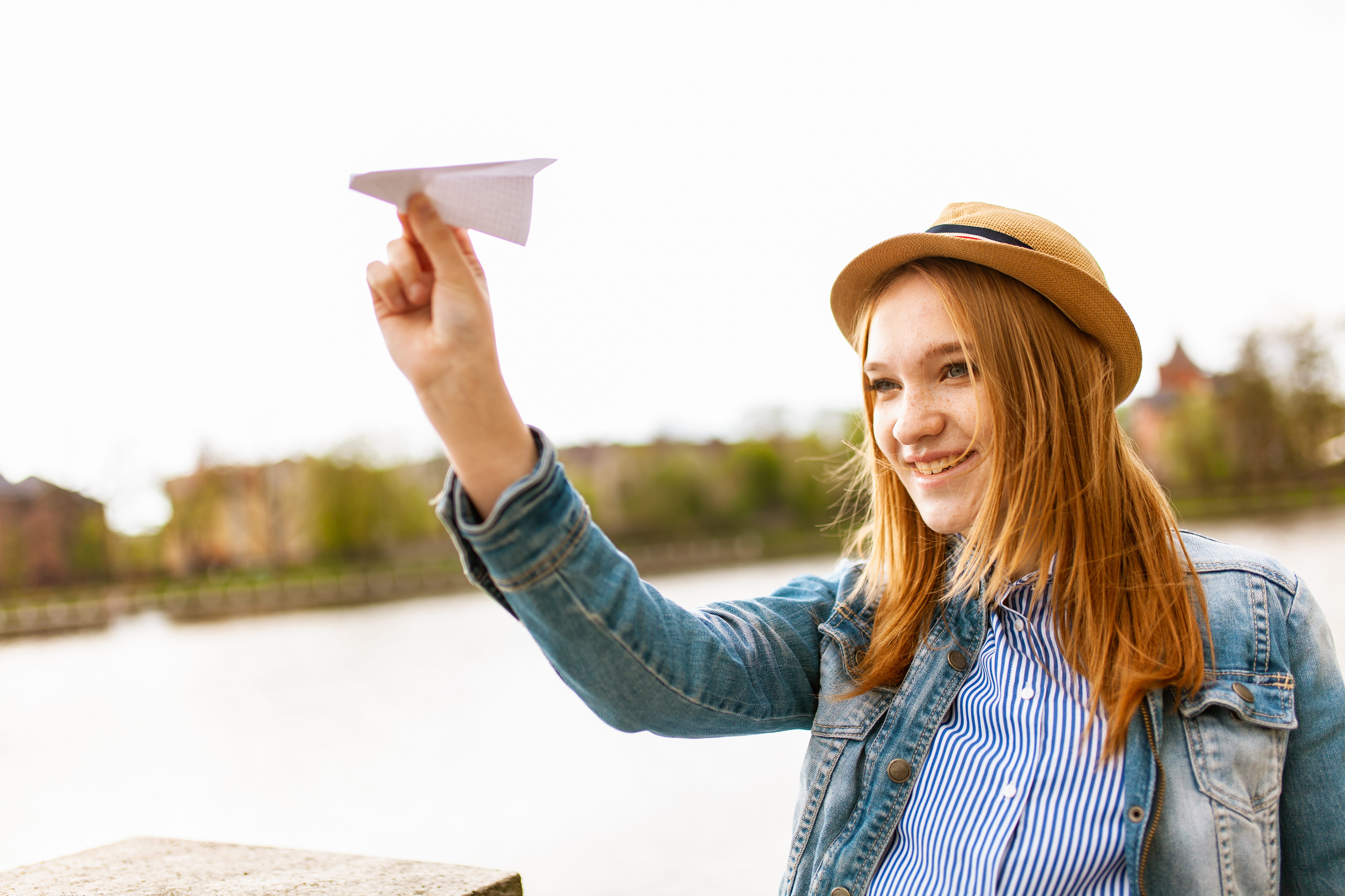 leisure, woman, person, holding, day, female, long hair, paper plane, hat, adult, one person, hand, nature, hairstyle, portrait, paper, plane, river, toy plane, HD Wallpaper