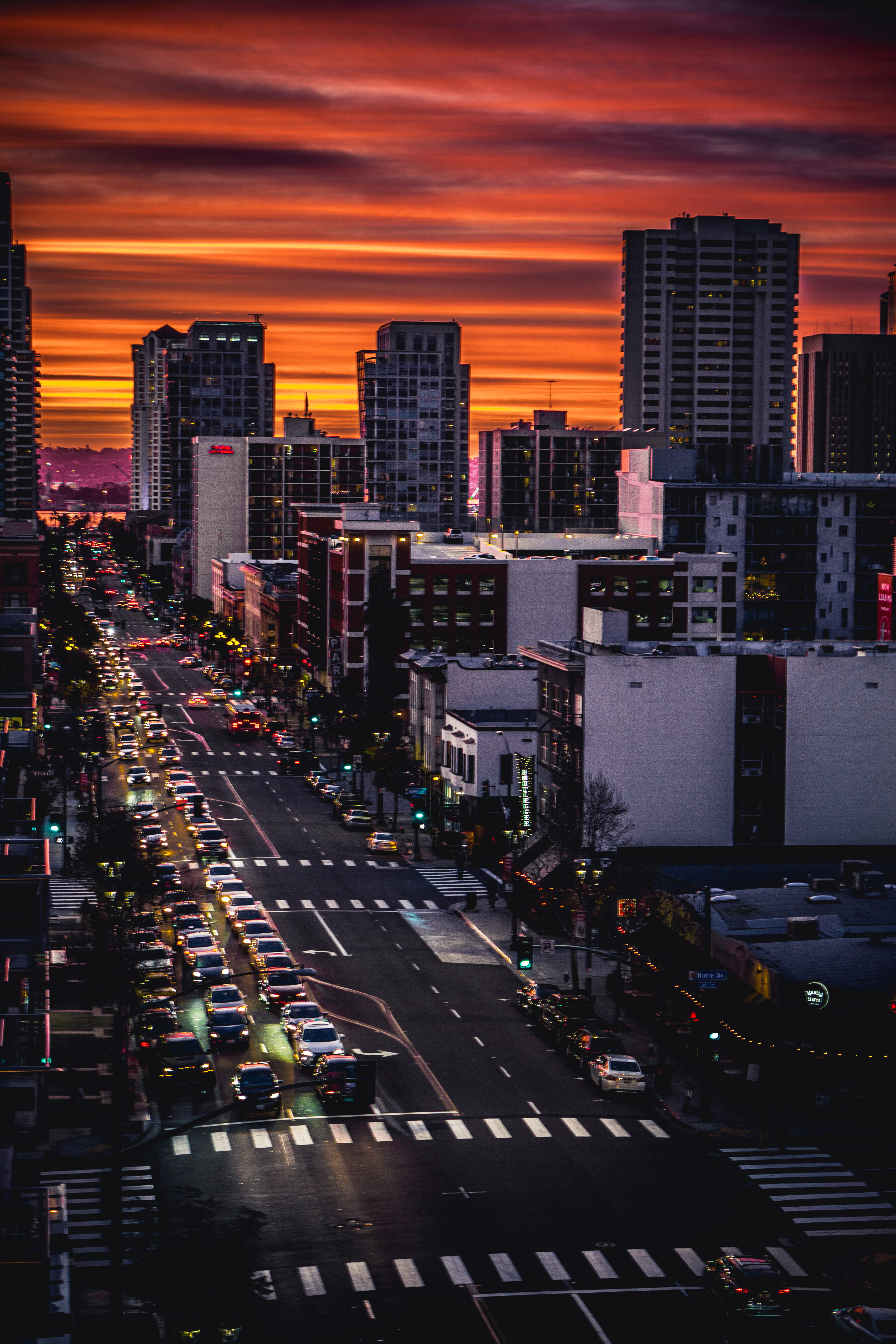 orange, clouds, cars, sundown, city life, cloud, dramatic, city, sunset, traffic, office building exterior, dusk, transportation, 5K, skies, mode of transportation, Phone HD Wallpaper