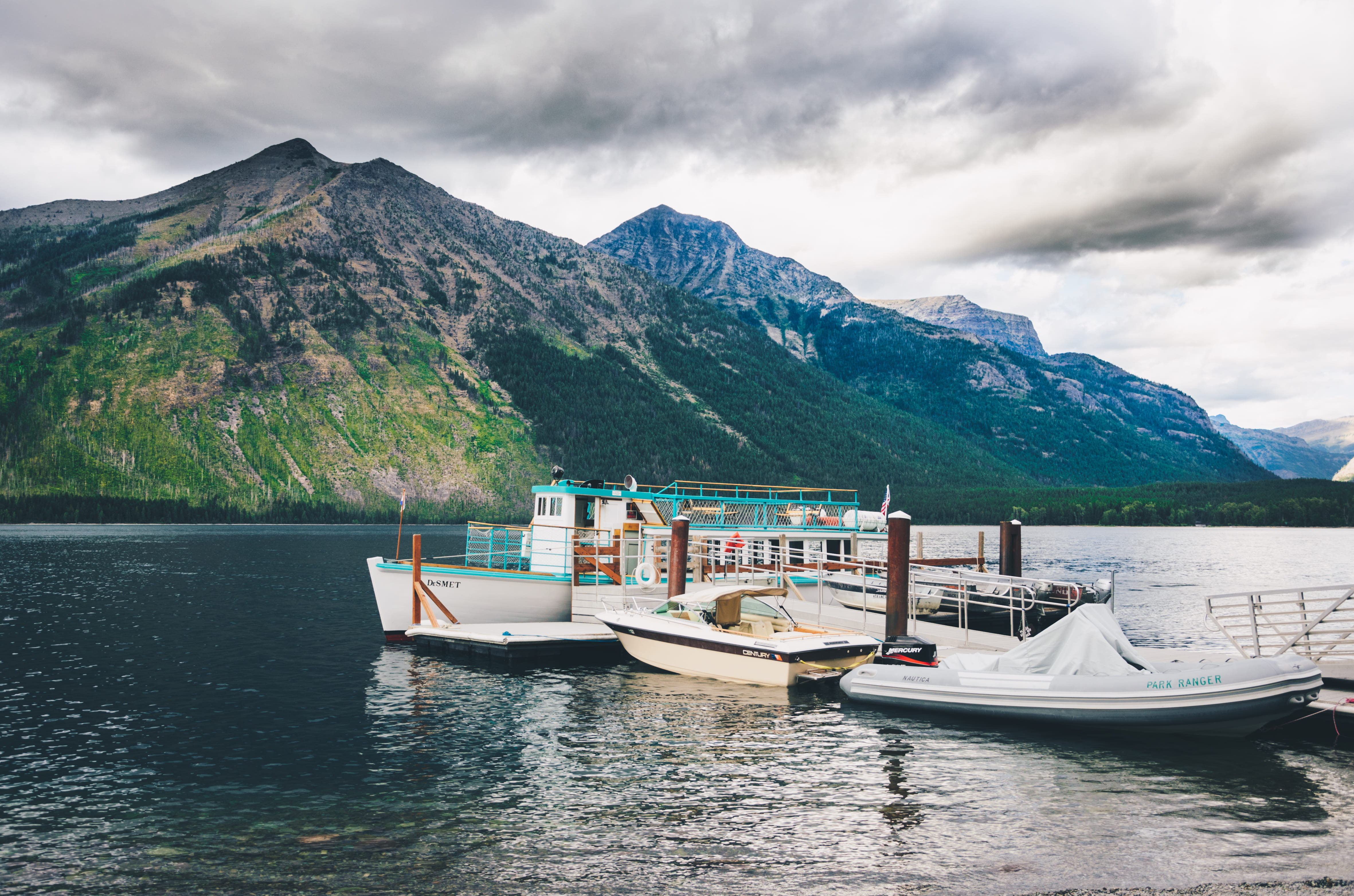 mountain range, lake mcdonald lodge, beauty in nature, nature, outdoors, dock, travel, waterfront, water, anchored, watercraft, mode of transportation, HD Wallpaper