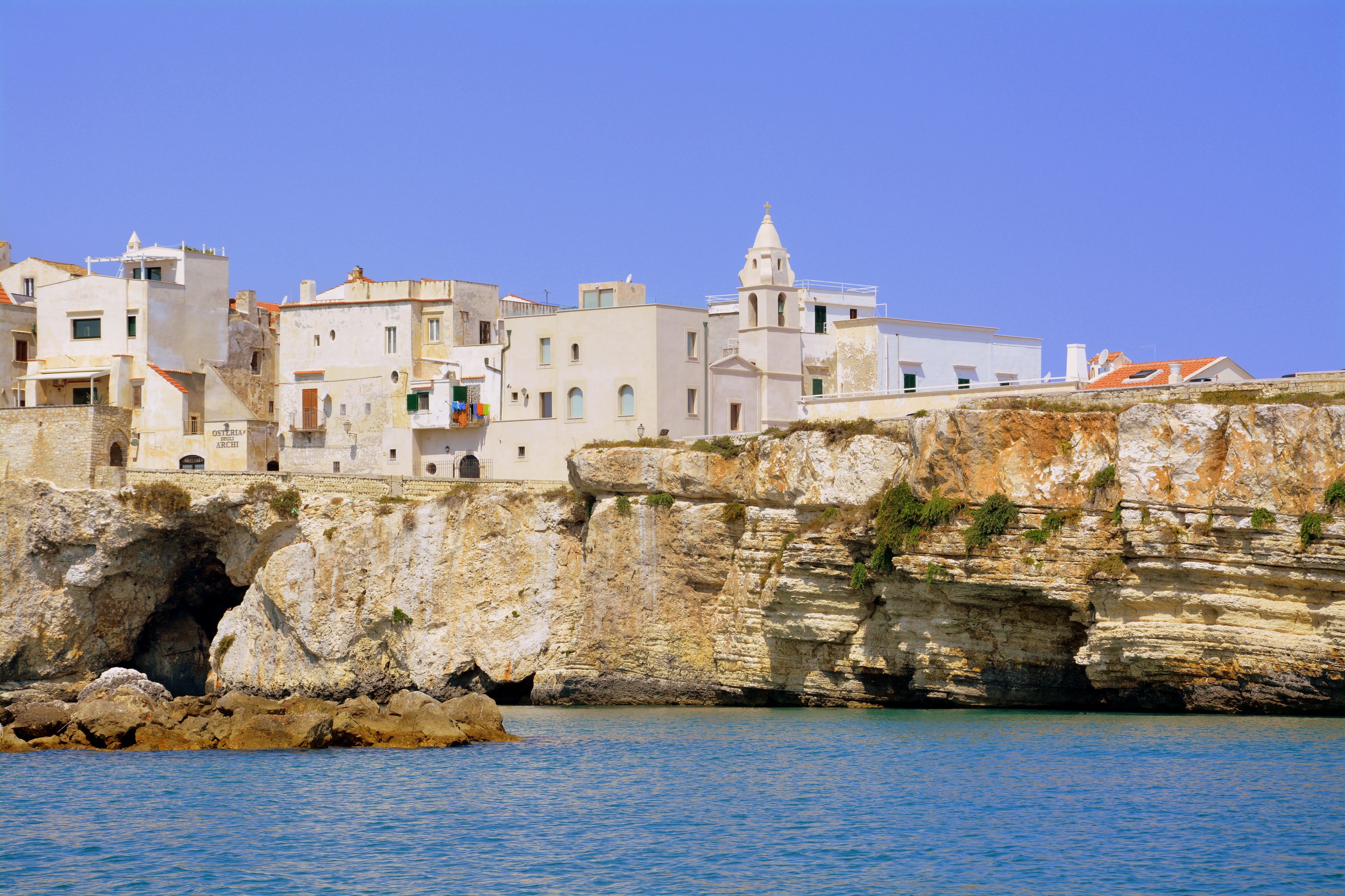 tourism, sky, blue, no people, stone material, building exterior, city, puglia, 5K, houses, outdoors, water, rock - object, campanile, gargano, history, HD Wallpaper