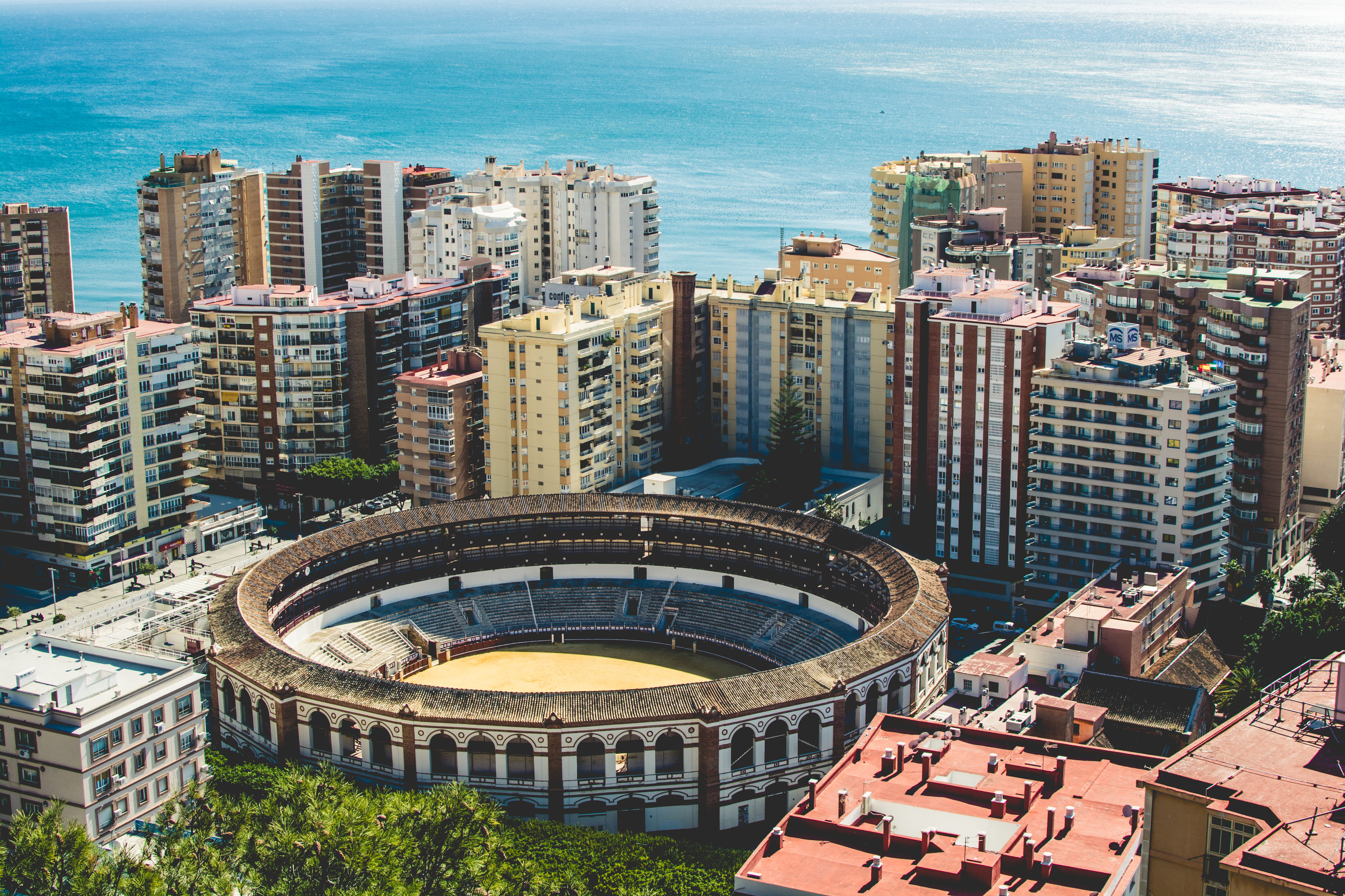 coliseum, arena, europe, malaga, fight, skyscraper, modern, no people, water, summer, day, building exterior, office, málaga, tall - high, work, built structure, HD Wallpaper