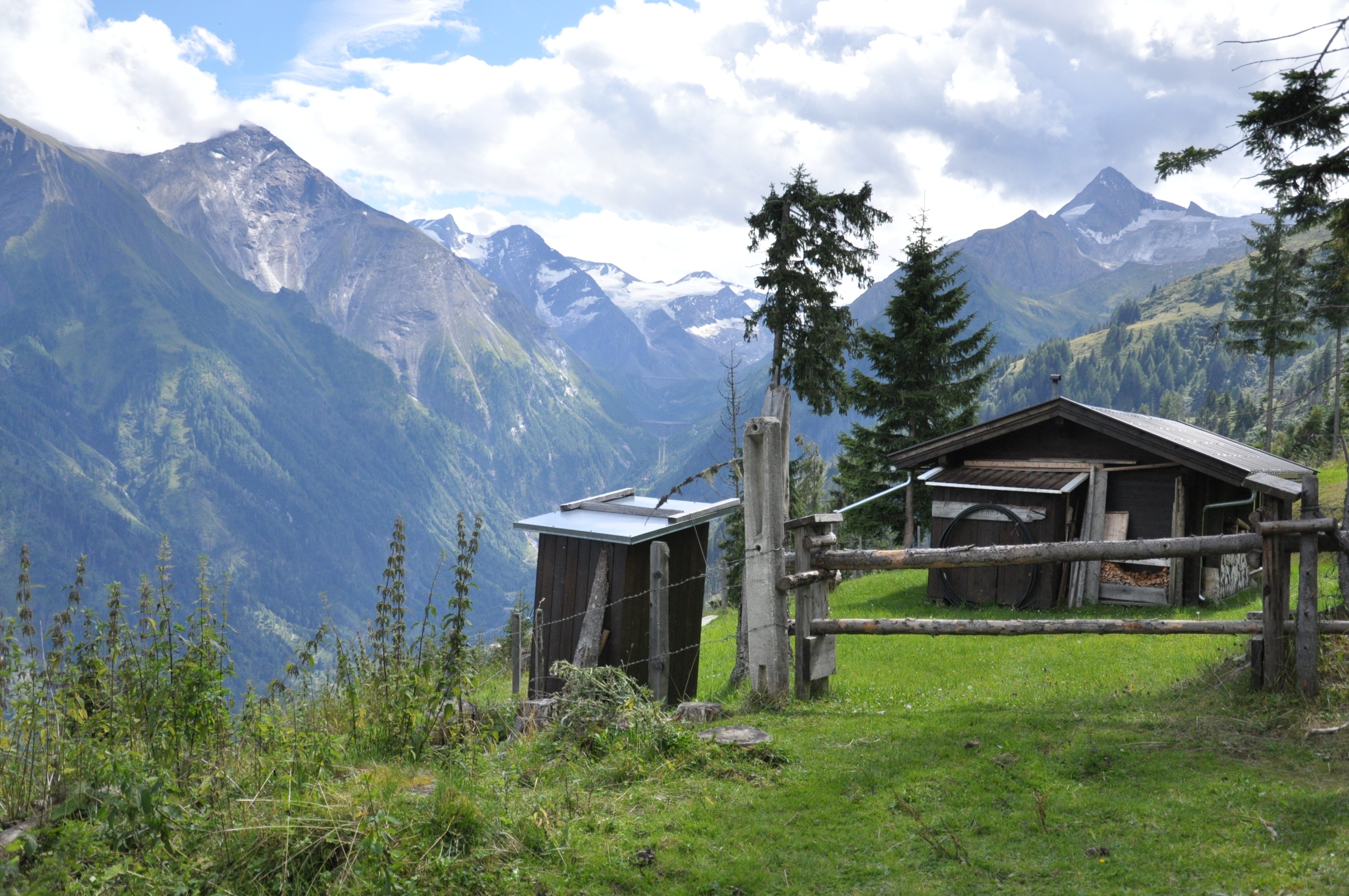 sky, mountain peak, built structure, plant, austria, grass, outdoors, landscape, shanty, building exterior, alps, day, architecture, green color, snowcapped mountain, HD Wallpaper