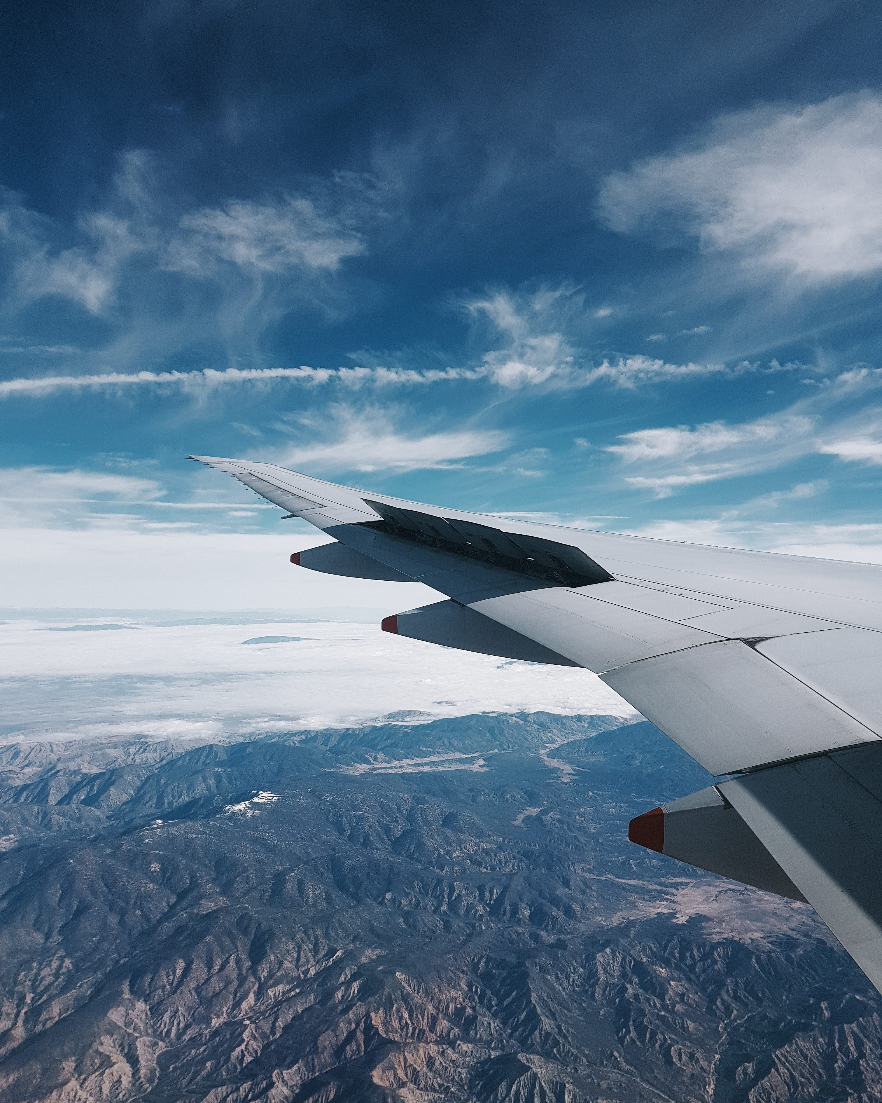 airplane, mode of transportation, 2K, sky, hills, mid-air, flight, grey, adventure, cloud - sky, environment, no people, window, nature, motion, day, scenics - nature, Phone HD Wallpaper