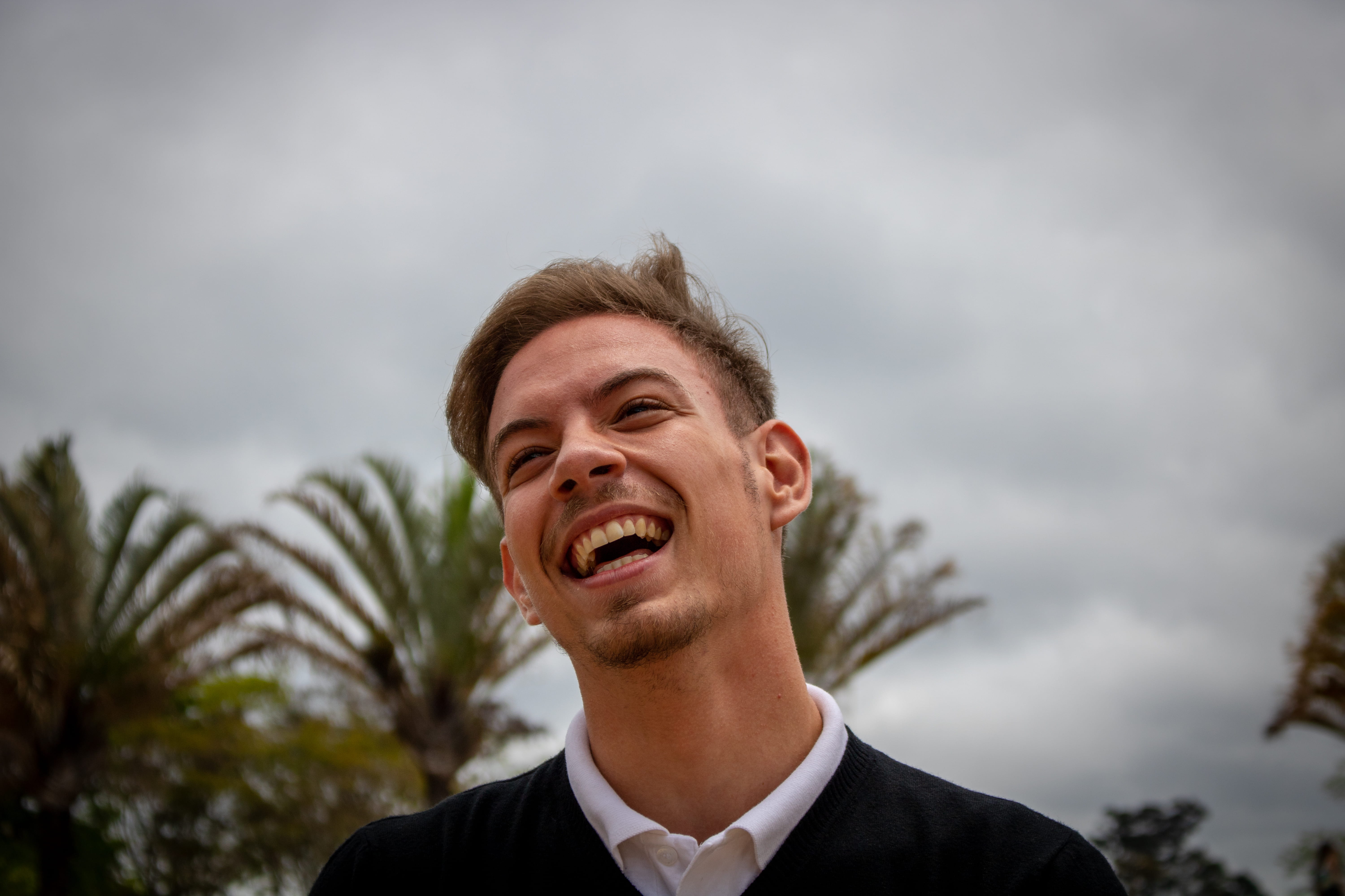 outdoors, shirt, laughing, white, cloud - sky, collared, brazil, happiness, wearing, emotion, face, nature, man, standing, young adult, focus on foreground, HD Wallpaper