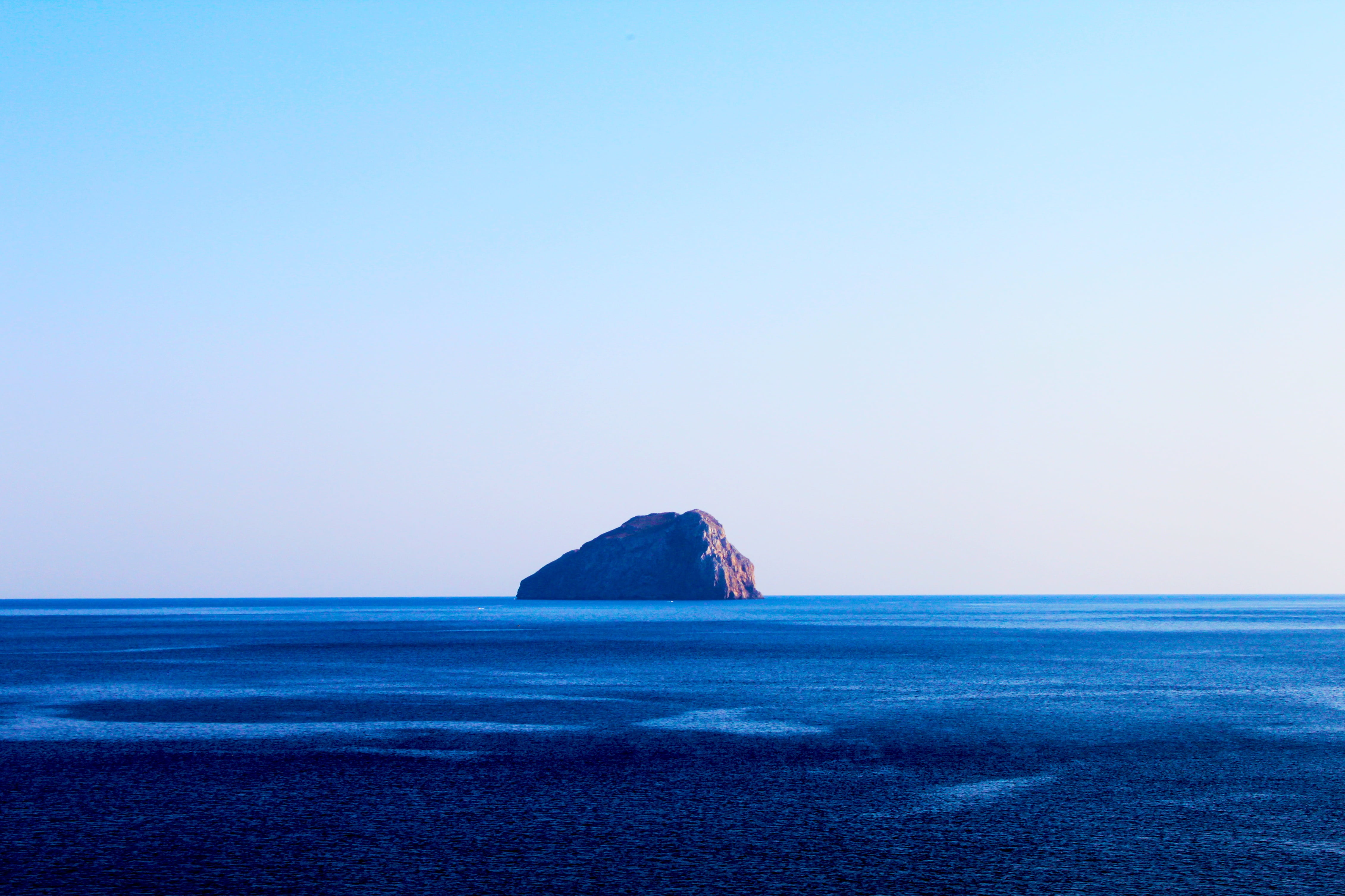 land, outdoors, horizon over water, island, rock, cliff, copy space, beauty in nature, no people, daytime, view, tranquil scene, tranquility, nature, clear sky, HD Wallpaper