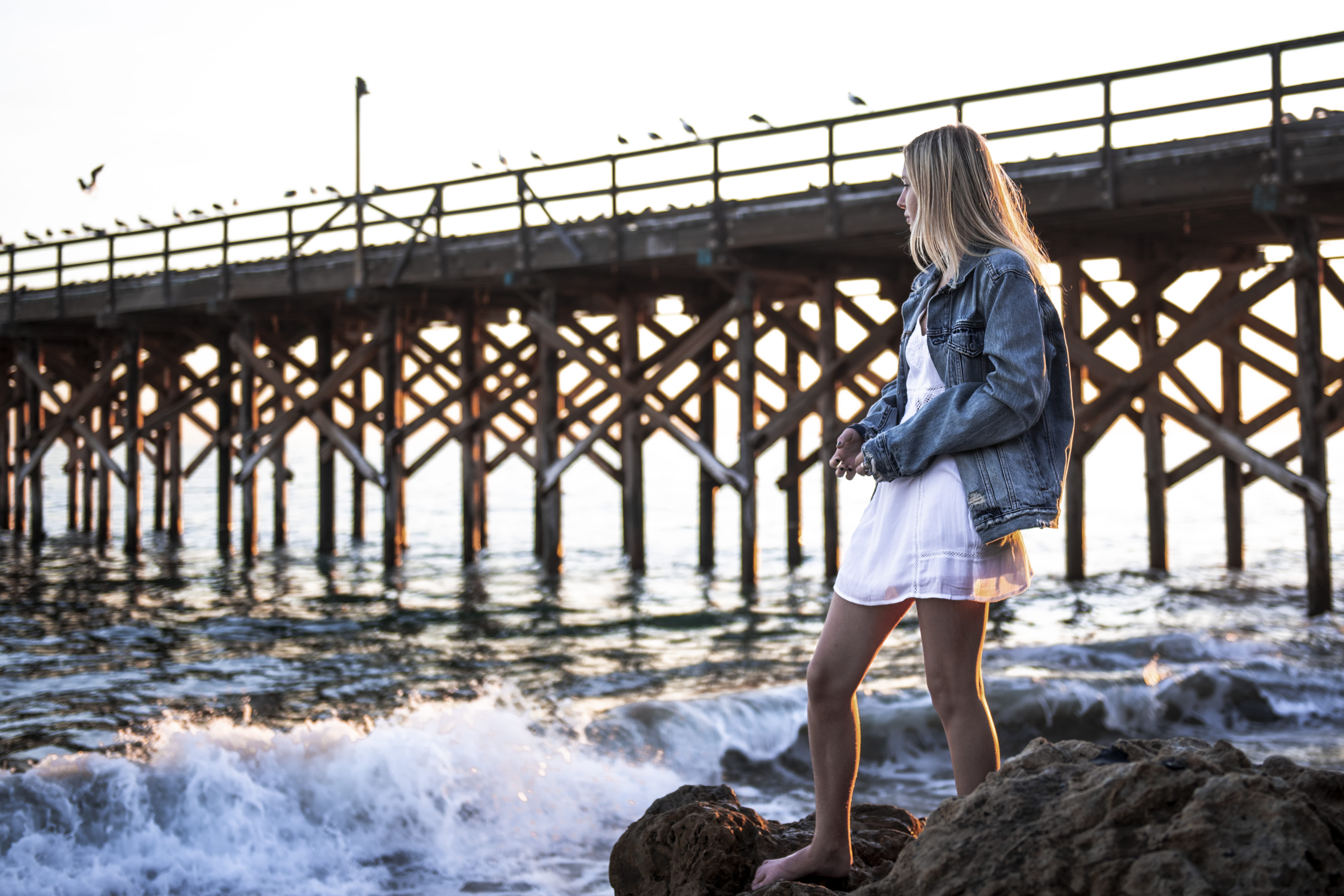 seashore, nature, rock, near, beautiful woman, leisure activity, standing, lady, shore, beach, leisure, blonde, jetty, one person, water, dress, waves, HD Wallpaper