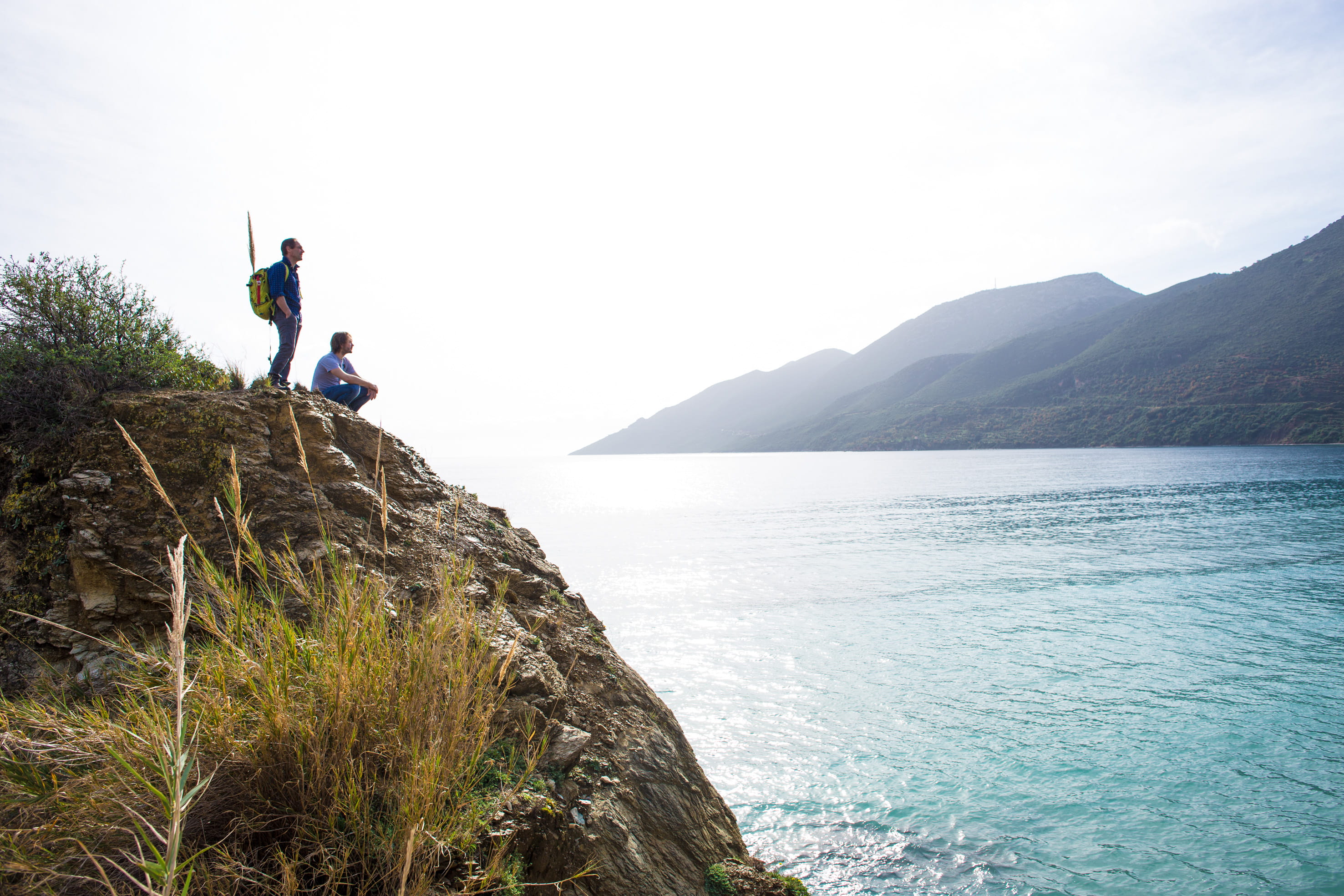 guy, water, looking at view, man, mountain, scenics - nature, outdoors, peloponnese, tranquil scene, men, ocean, sea, two people, nature, rock - object, HD Wallpaper