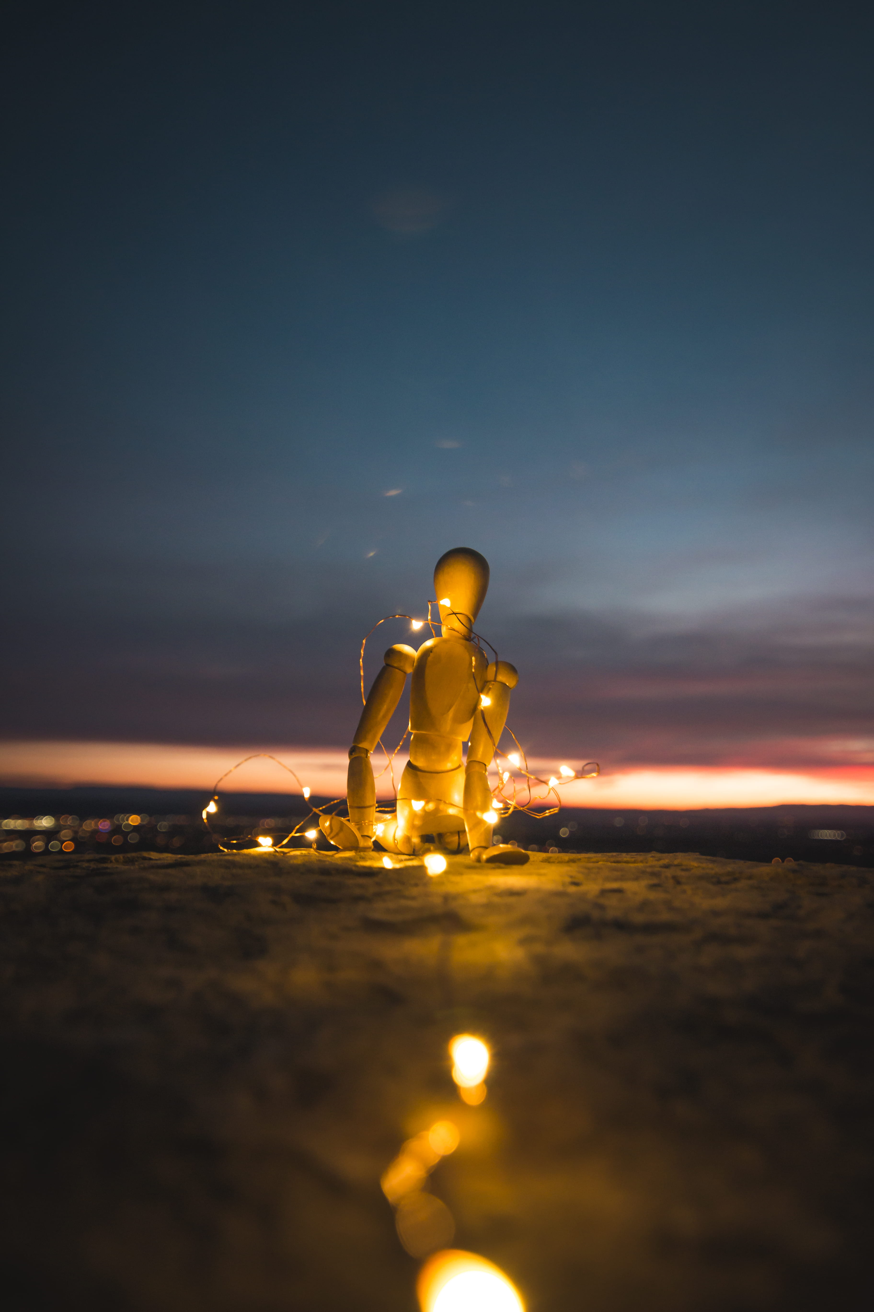 stand, surface level, land, 5K, sky, adult, led, statue, outdoors, fairy light, beauty in nature, dirt, real people, mannequin, doll, marionette, lights, Phone HD Wallpaper