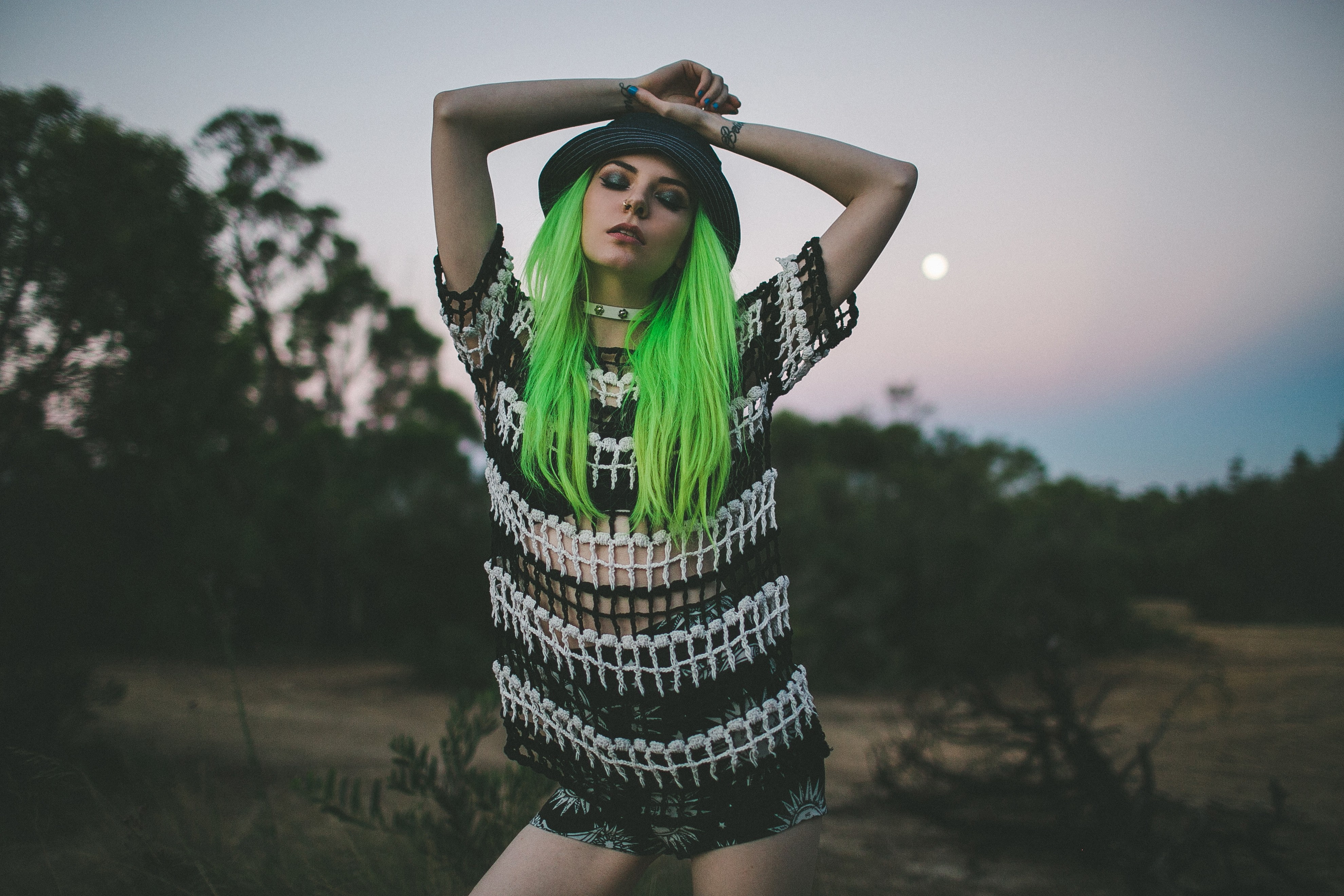 collars, short shorts, hands on head, choker, women outdoors, model, women, dyed hair, green hair, nose rings, hat, 4K, closed eyes, tattoo, blue nails, HD Wallpaper