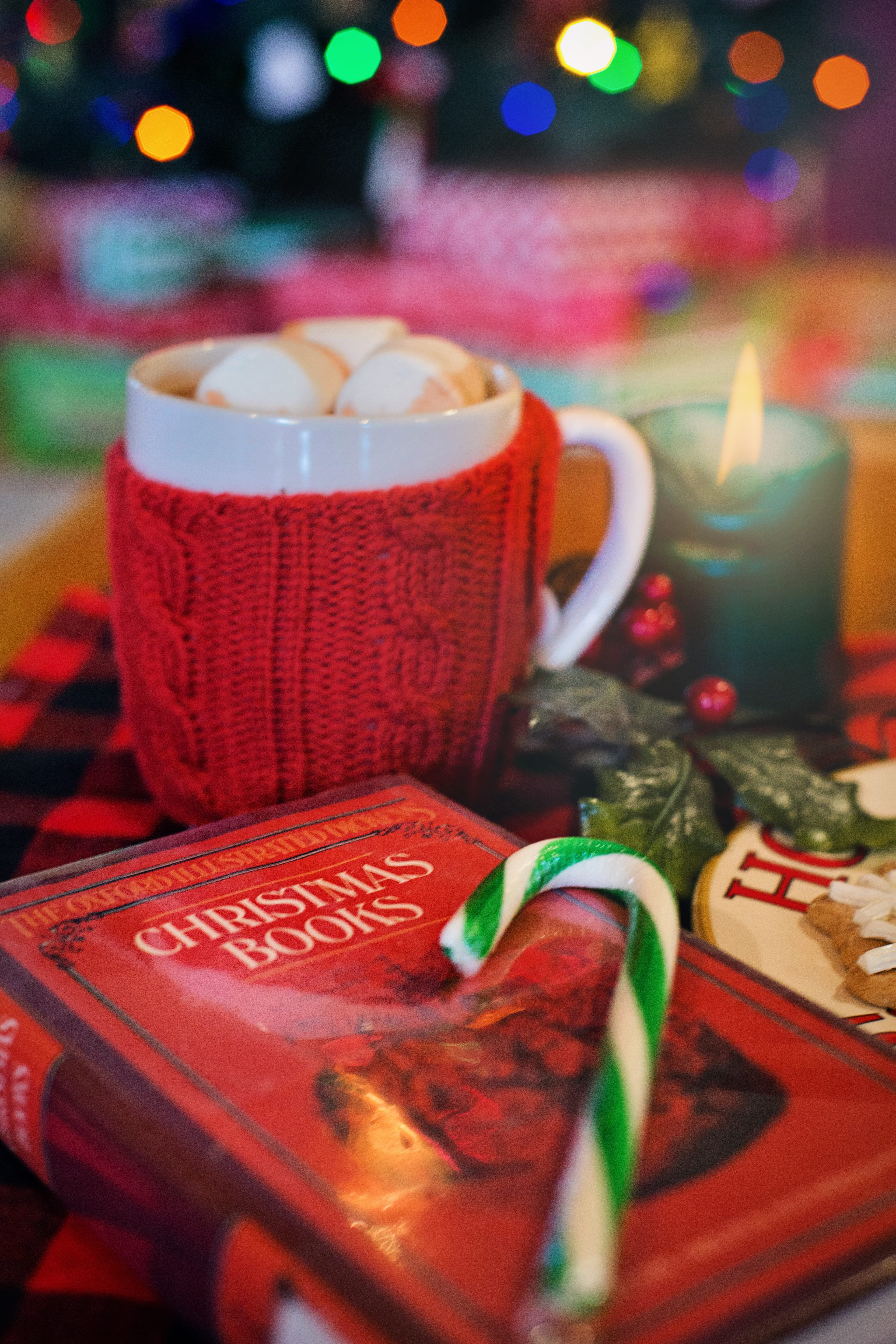 still life, candy, book, reading, table, mug, celebration, 5K, cup, text, refreshment, freshness, candle, illuminated, selective focus, food and drink, Phone HD Wallpaper
