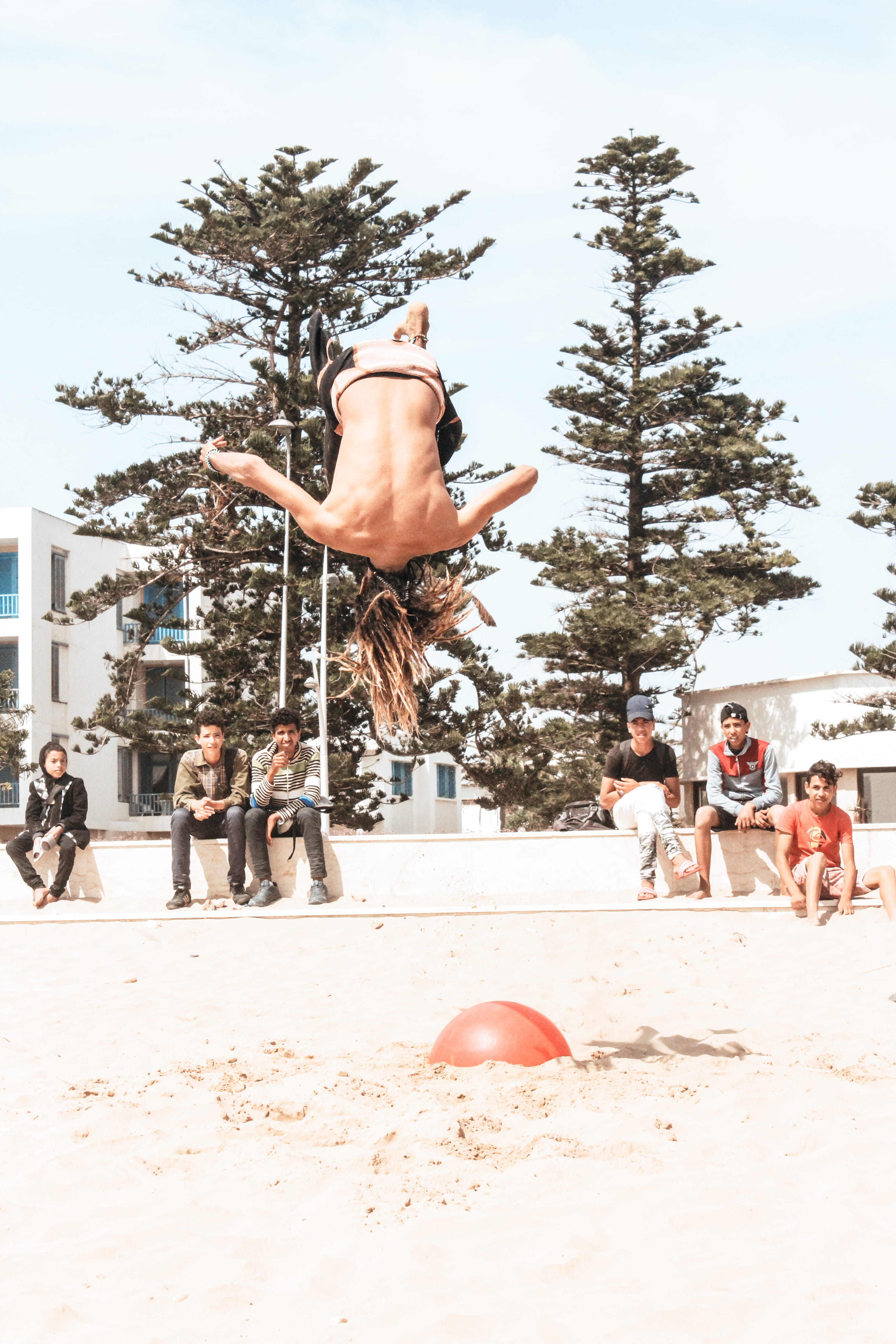 audience, swimwear, mid-air, full length, daytime, soil, essaouira, 5K, lifestyles, people, men, tumbling, sand, large group of people, backflip, shirtless, Phone HD Wallpaper