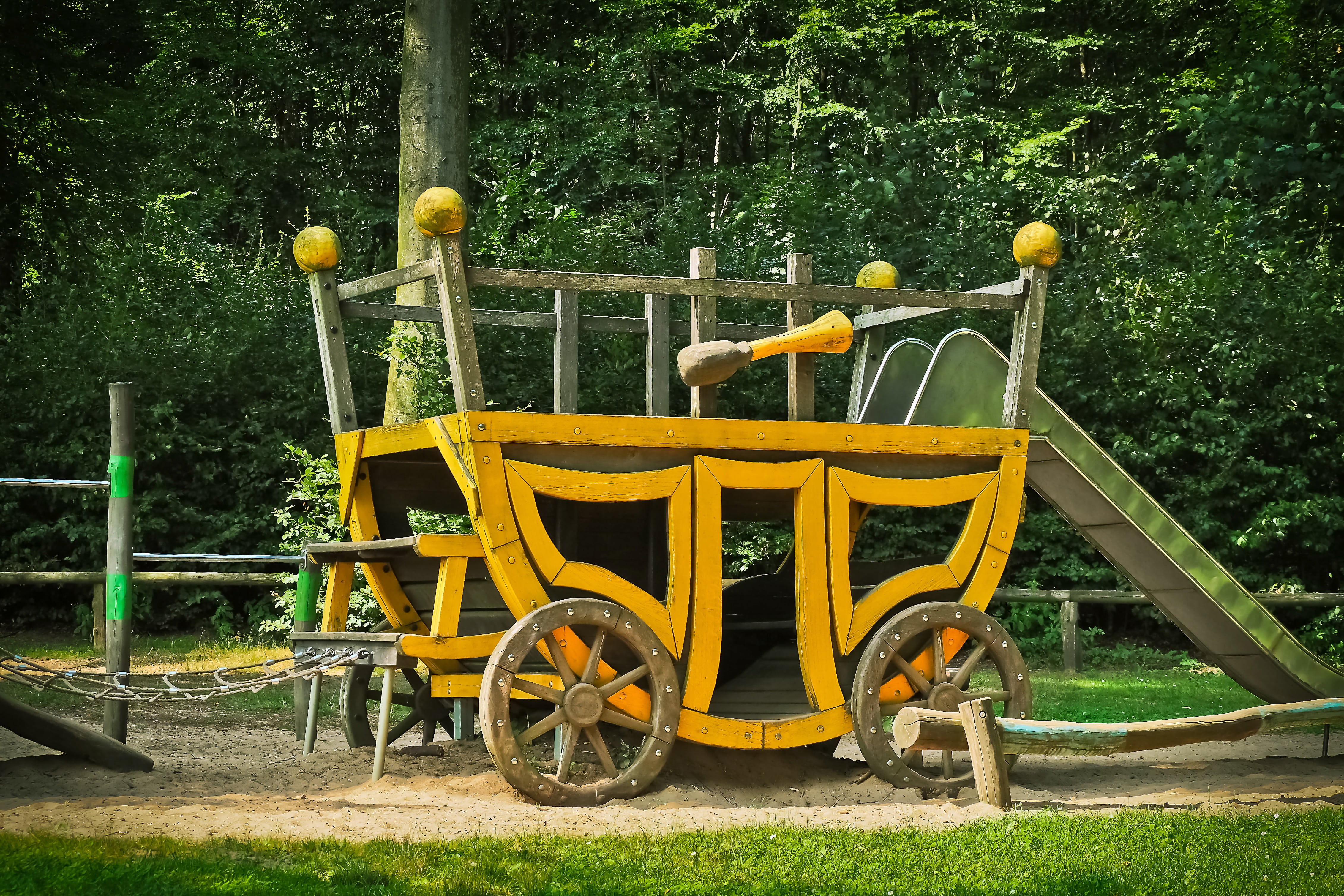 game device, yellow, nature, coach, 4K, outdoors, no people, wheel, plant, barrier, sand pit, bar, land, children, play, leisure, kletterhaus, fairytale, HD Wallpaper