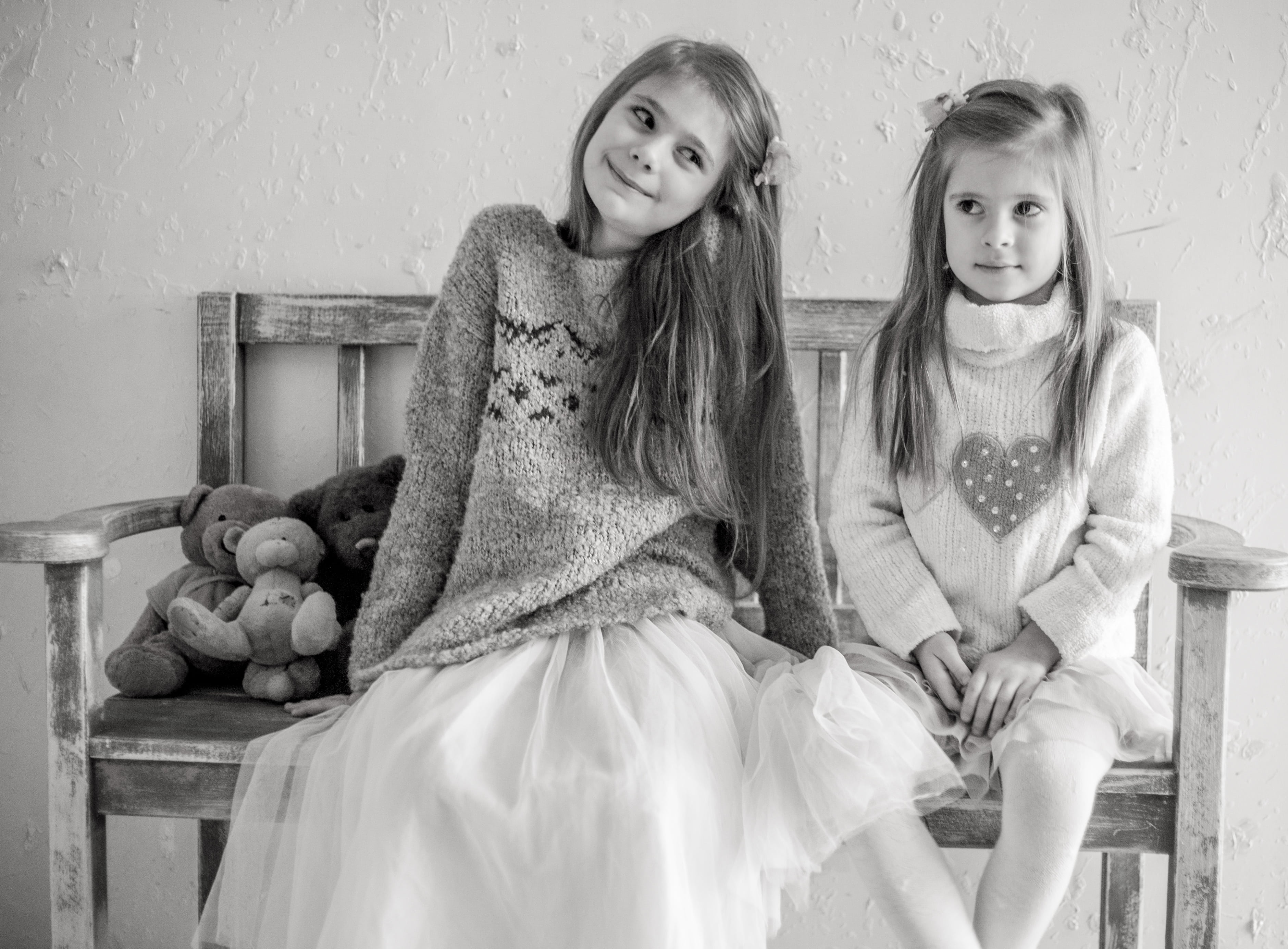 indoors, bench, two people, sibling, grayscale, togetherness, childhood, lifestyles, bears, sits, girl, the little girl, children only, looking at camera, HD Wallpaper