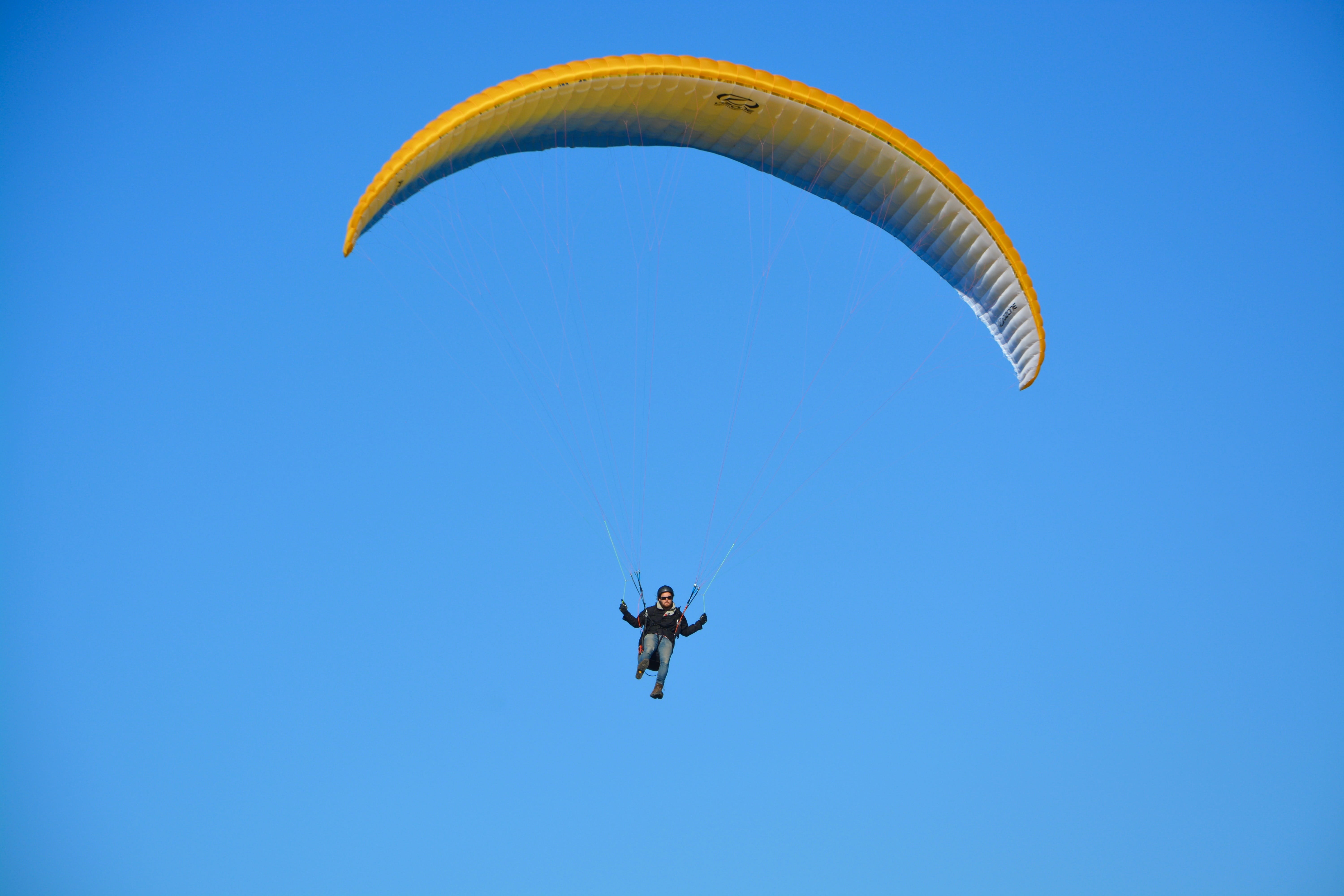 extreme sports, blue sky, sky, outdoors, flight, paraglider, activity, joy, aircraft, unrecognizable person, air, color orange blue, 5K, nature, freedom, HD Wallpaper