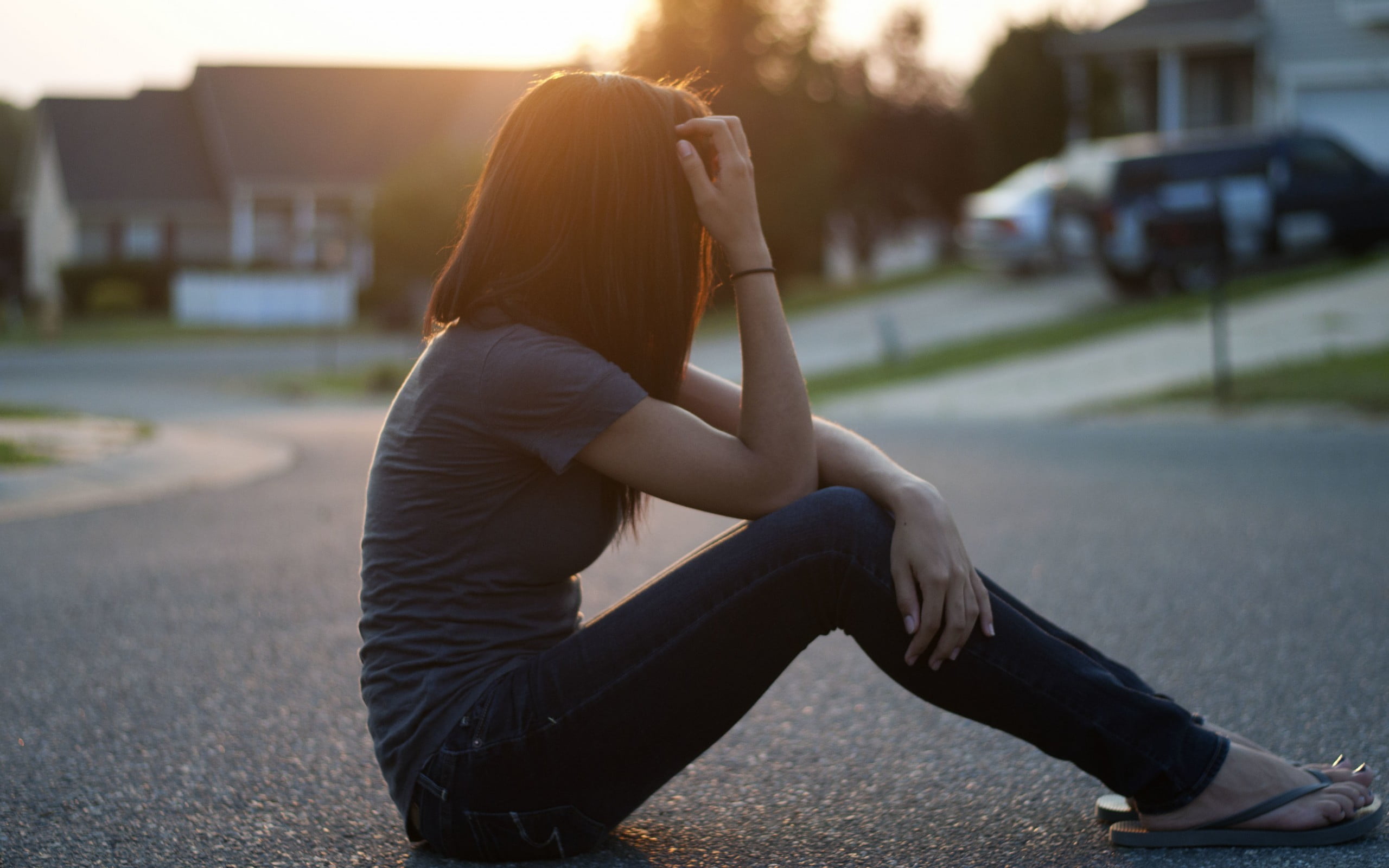 women outdoors, road, hair in face, young adult, city, jeans, sunset, casual clothing, 2K, sitting, nature, transportation, one person, focus on foreground, HD Wallpaper