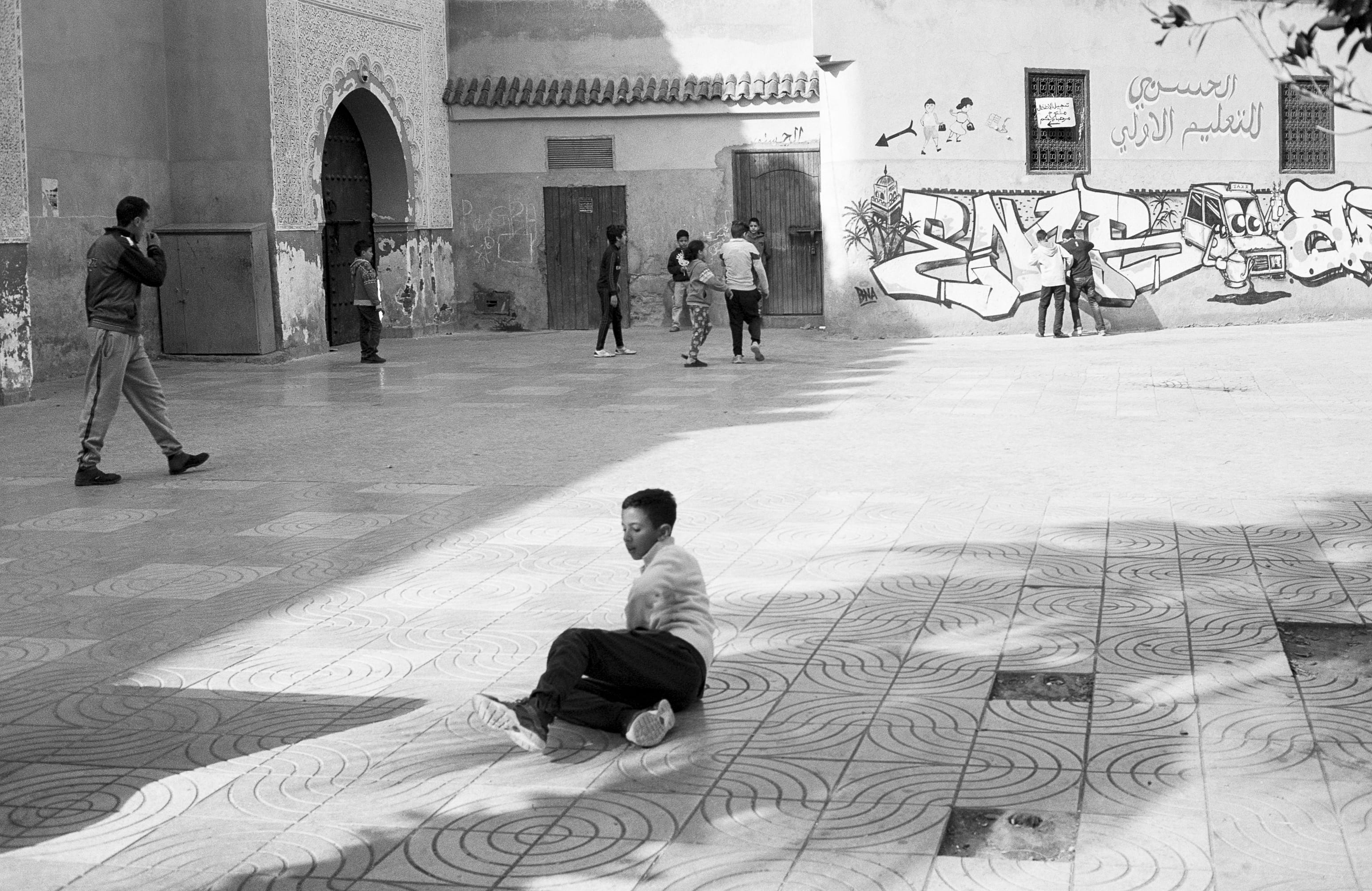 marrakesh, gx, adult, street, spirituality, morocco, text, ilford, real people, travel destinations, city, football, xp2 super, moroccan, full length, architectural column, HD Wallpaper