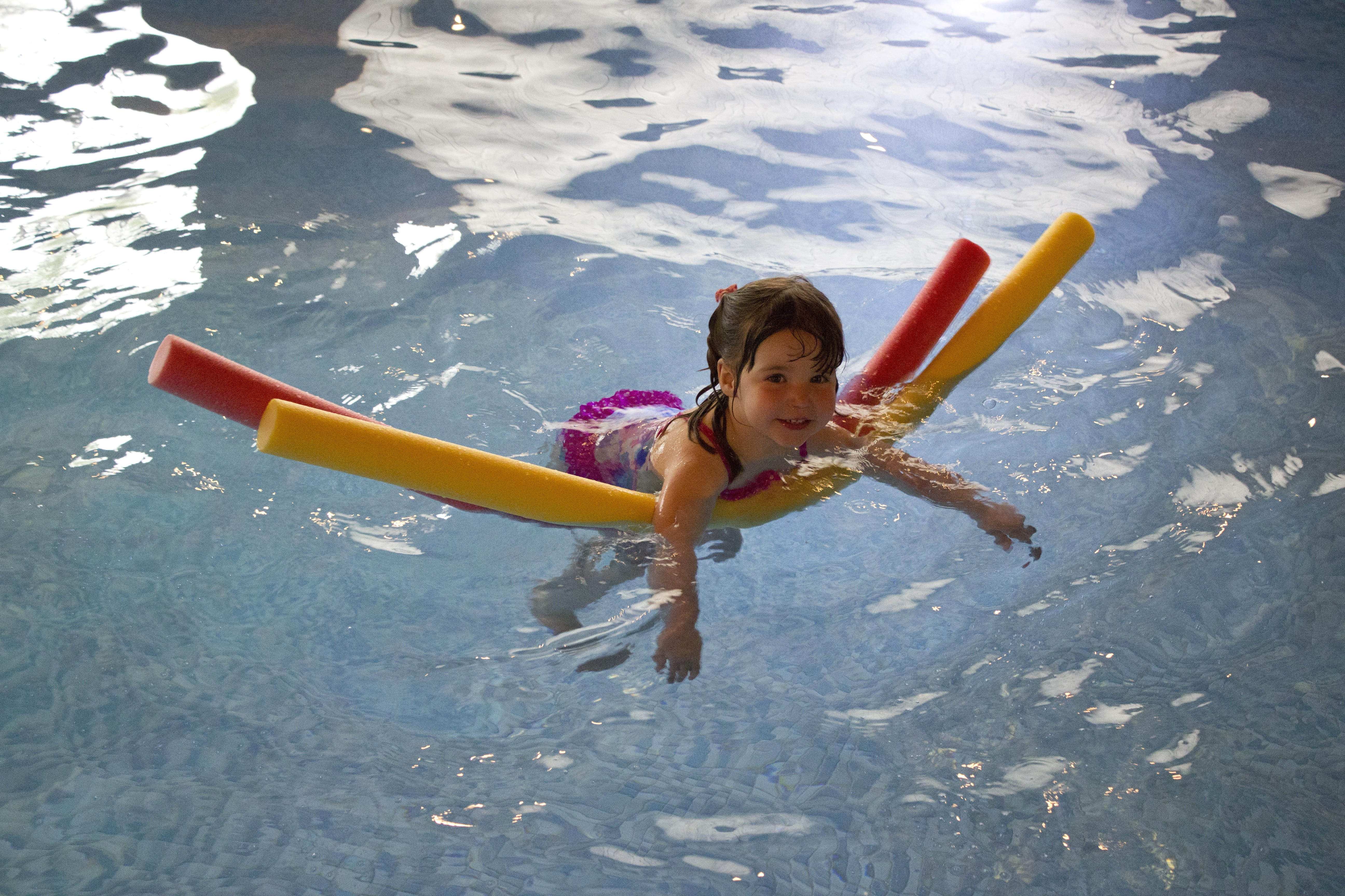 one person, girls, child, pink, lifestyles, wearing, noodles, sport, young, pool, real people, body of water, active, enjoyment, childhood, water, swimming, HD Wallpaper