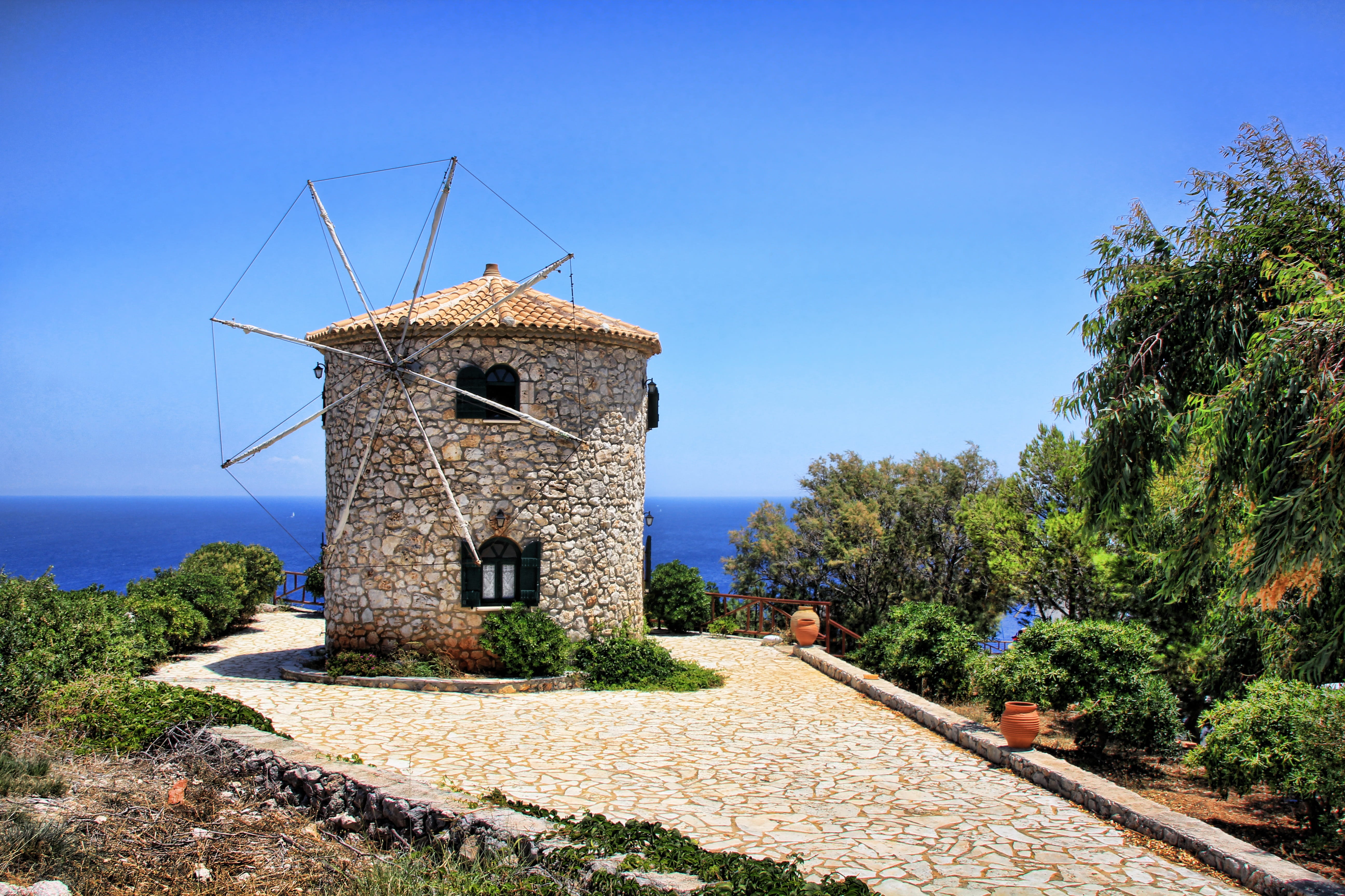 environmental conservation, turbine, tree, building exterior, wind turbine, greek island, ocean, surround, sea, outdoors, daytime, building, architecture, HD Wallpaper