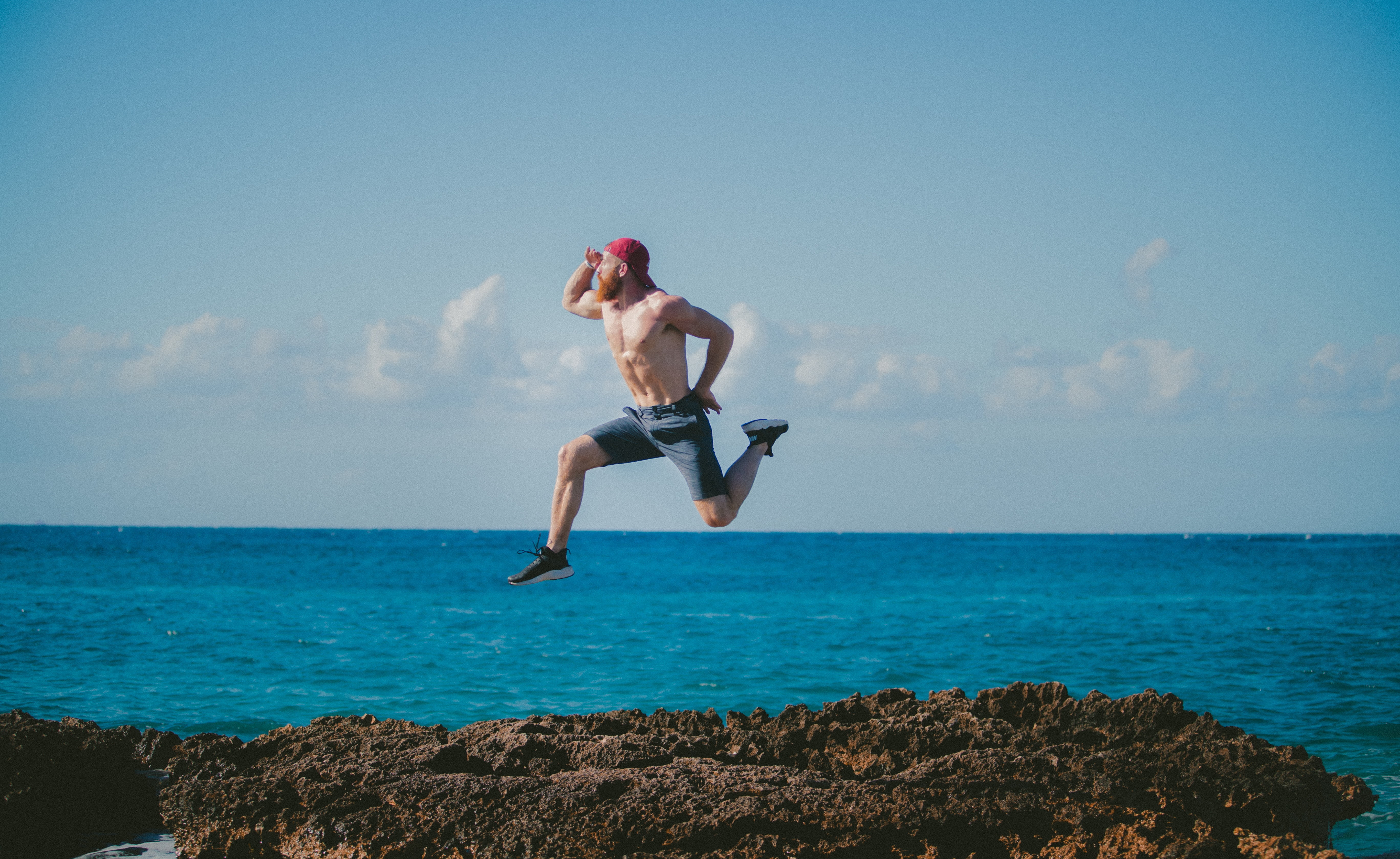 water, man, 5K, rock, horizon, vitality, nature, human arm, rock - object, sea, beach, jumping, horizon over water, outdoors, travel, lifestyles, one person, HD Wallpaper