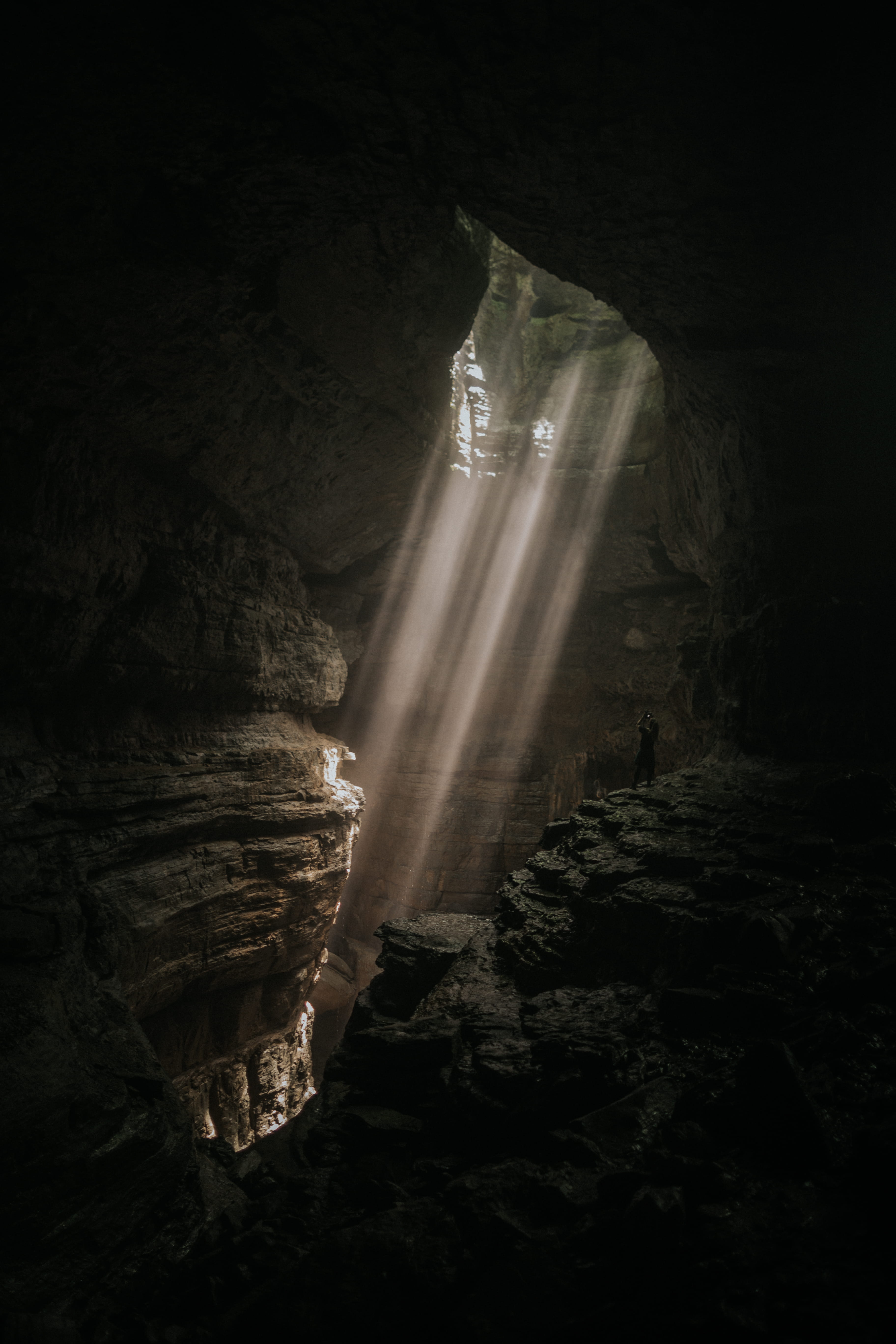 hole, person, mine, light, ray, black Color, outdoors, rock - Object, dark, night, tunnel, sunlight, underground, cave, beam, rock, wilderness, brown, explore, Phone HD Wallpaper