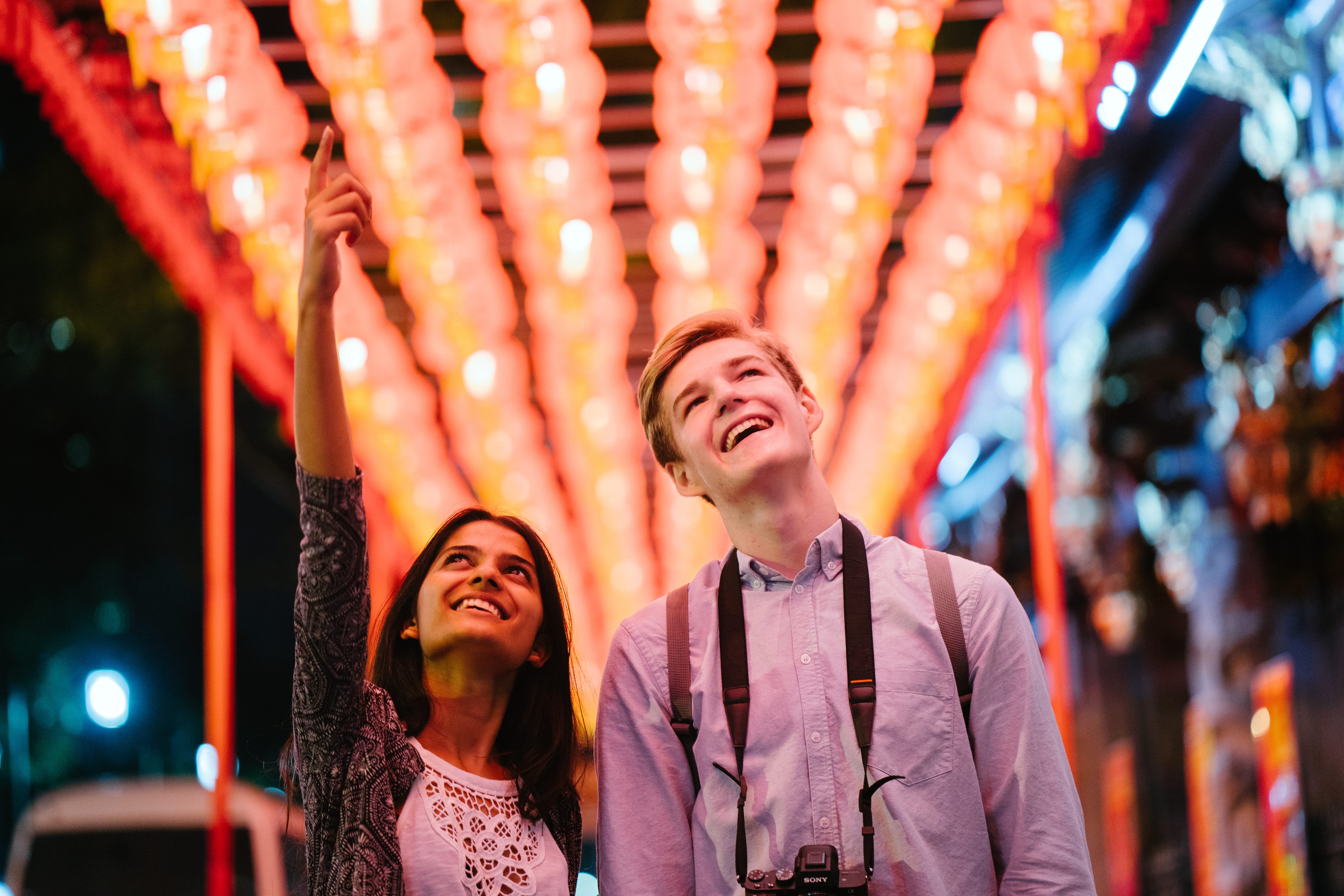 front view, people, night, man, attractive, lanterns, happiness, wear, blur, depth of field, explore, indian, young adult, street, joy, positive emotion, HD Wallpaper