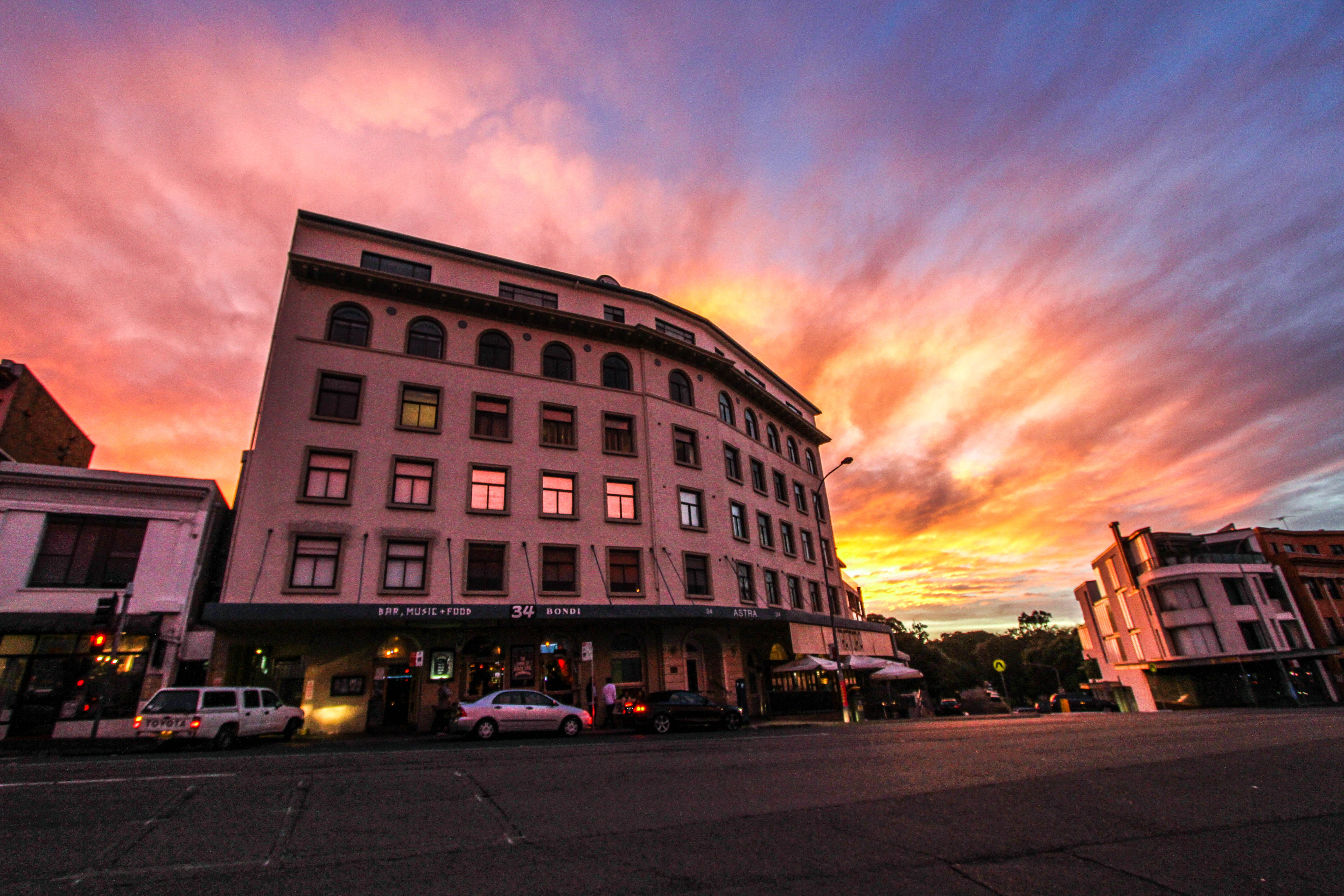 sunlight, pub, sky, dusk, transportation, sunset, road, cloud - sky, motor vehicle, buildings, street, orange, 5K, beautiful, architecture, building exterior, HD Wallpaper