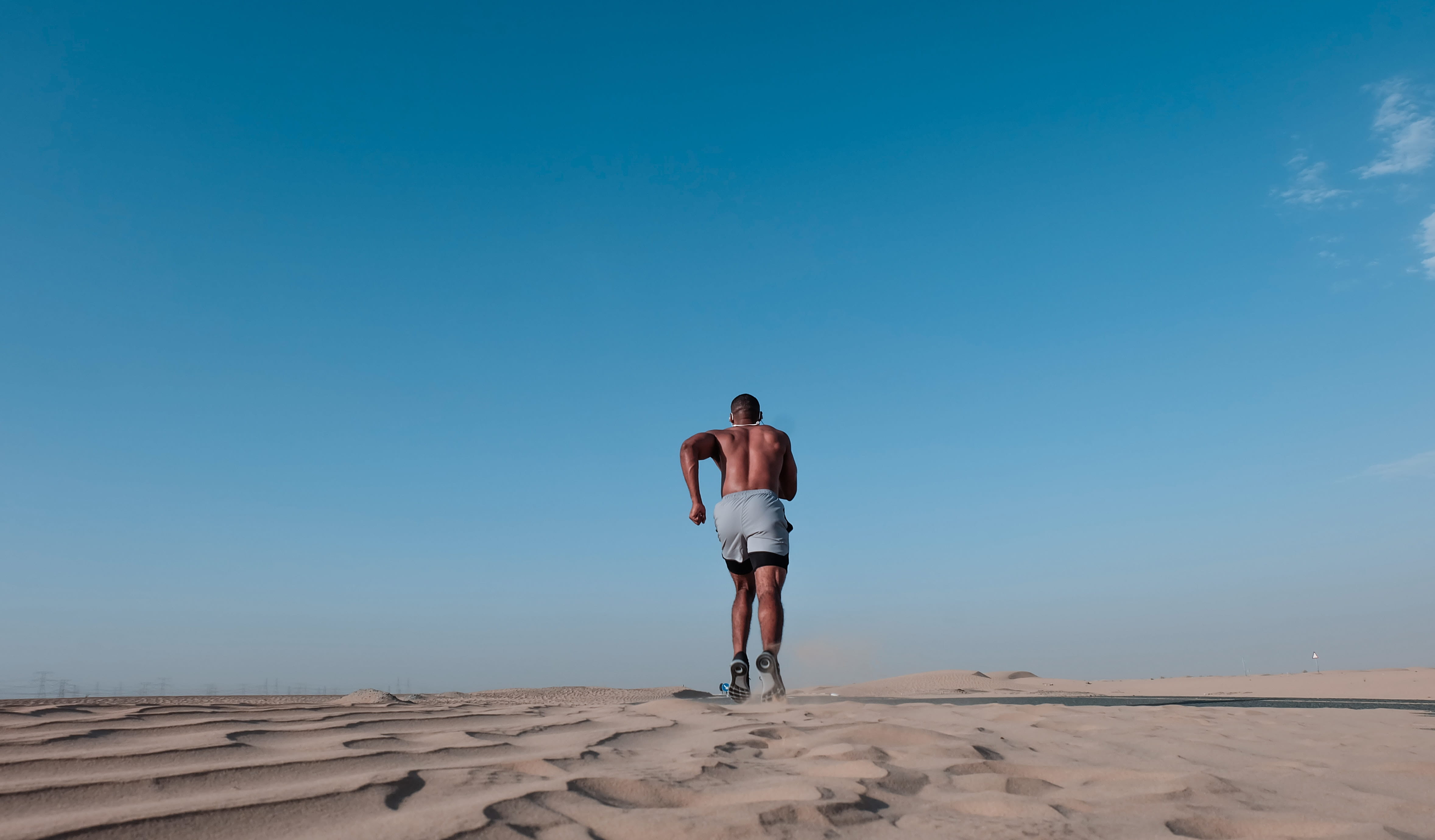 blue sky, one person, health, nature, standing, sand, casual clothing, shorts, man, speed, hurry, men, beach, sky, blue, lifestyles, adult, full length, HD Wallpaper