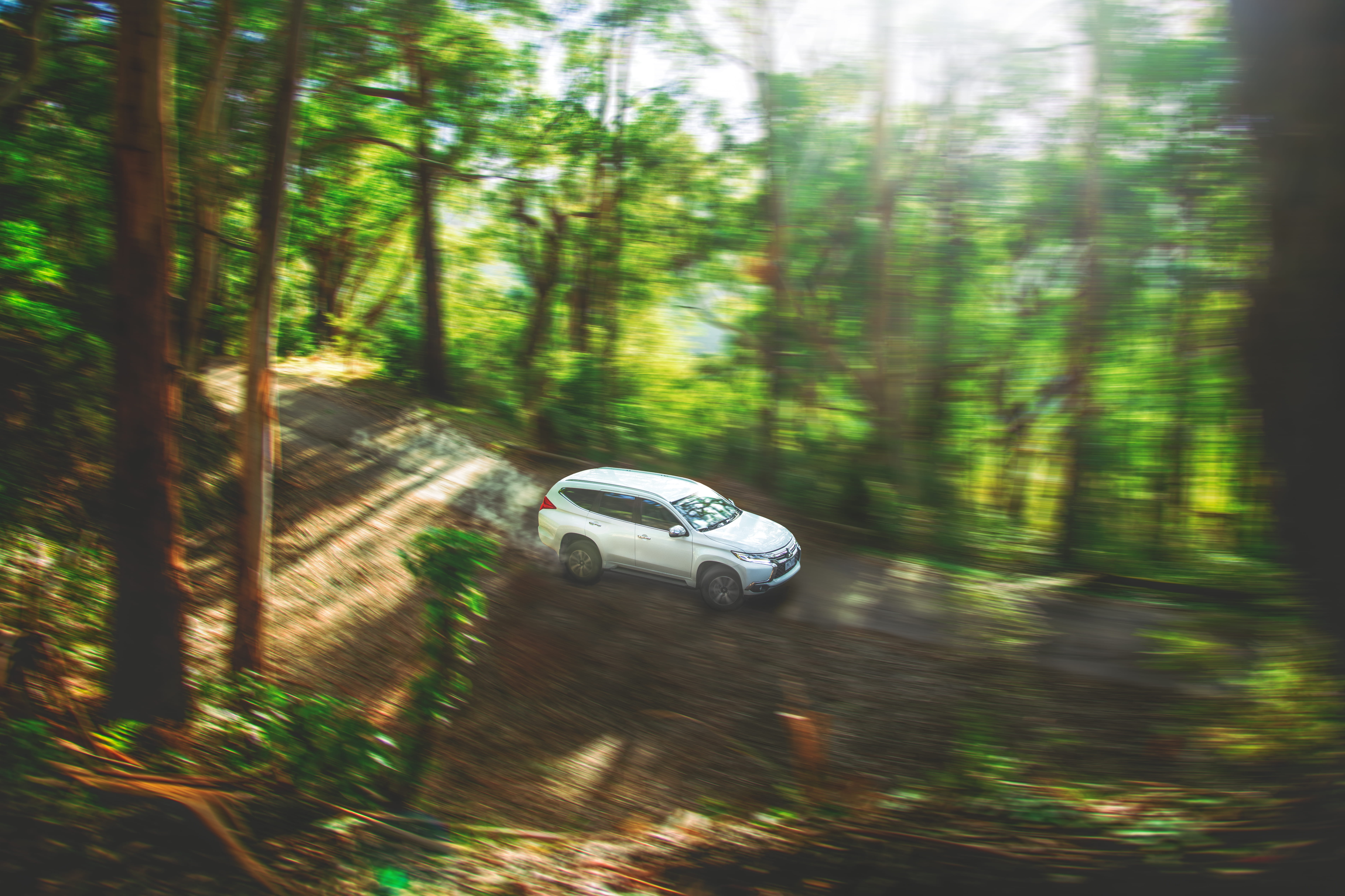 travel, sunlight, transportation system, fast, woodland, plant, dirt, environment, tree, photo, blurry, day, montero, car, land vehicle, mitsubishi, dirt road, HD Wallpaper