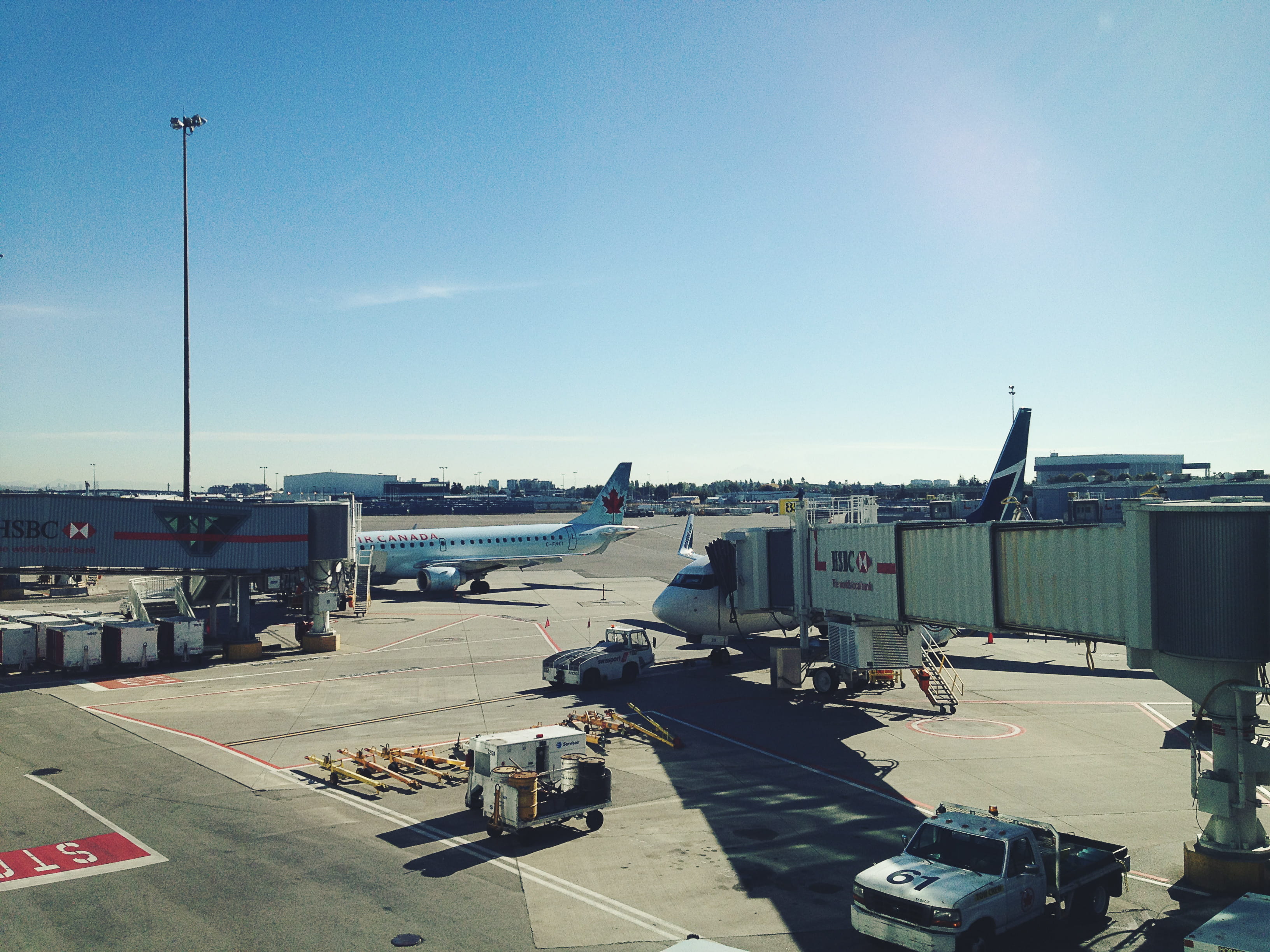 passenger boarding bridge, city, tourist, flying, air travel, airplane, built structure, airport, air vehicle, air canada, airplanes, yvr, 2K, road, day, HD Wallpaper